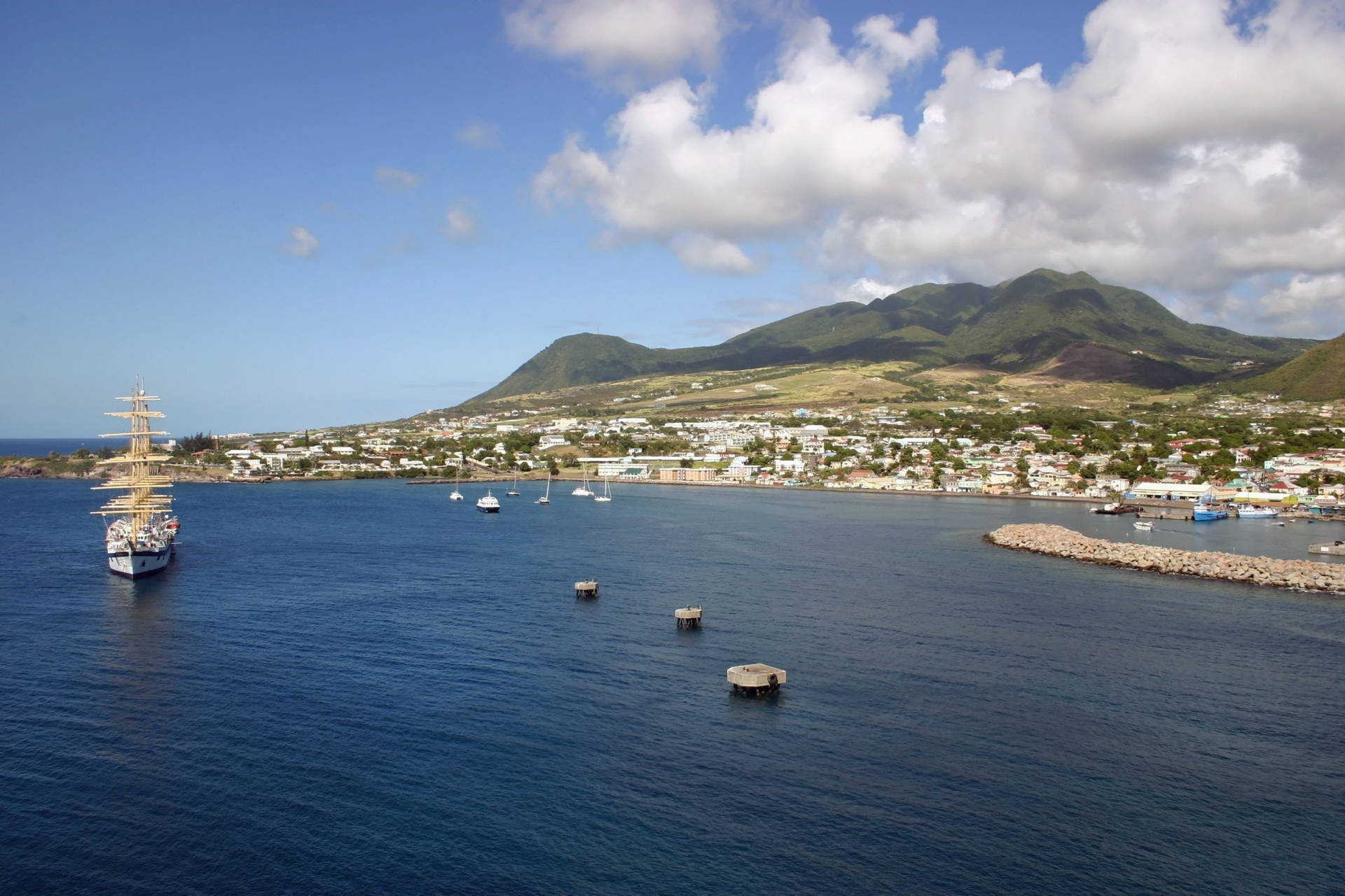 Caption: Scenic Docks and Boats in St. Kitts and Nevis Wallpaper