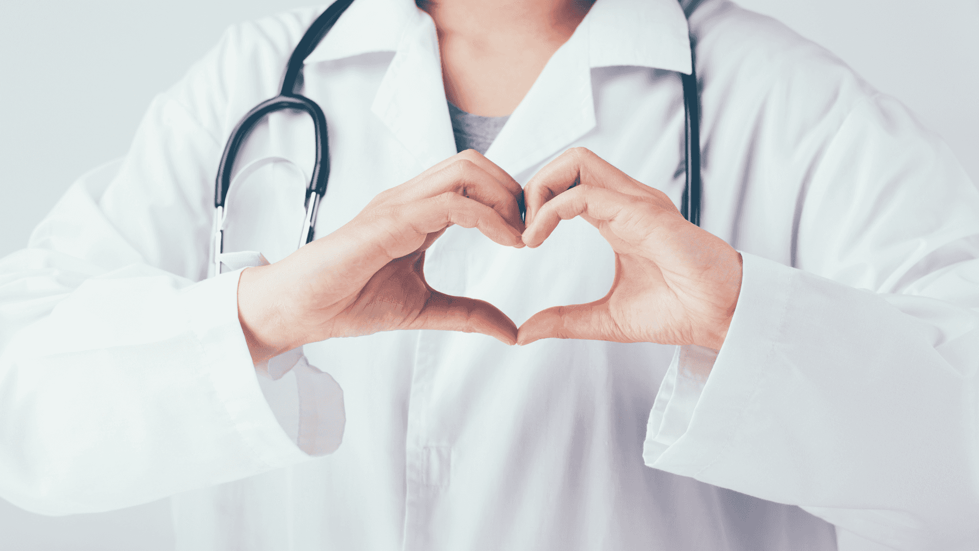 A Doctor Making A Heart Shape With His Hands