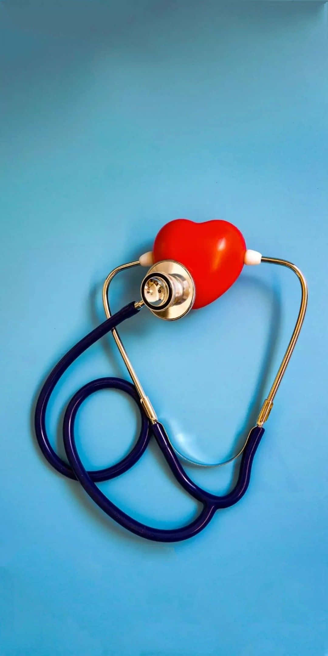 A Heart Shaped Stethoscope On A Blue Background