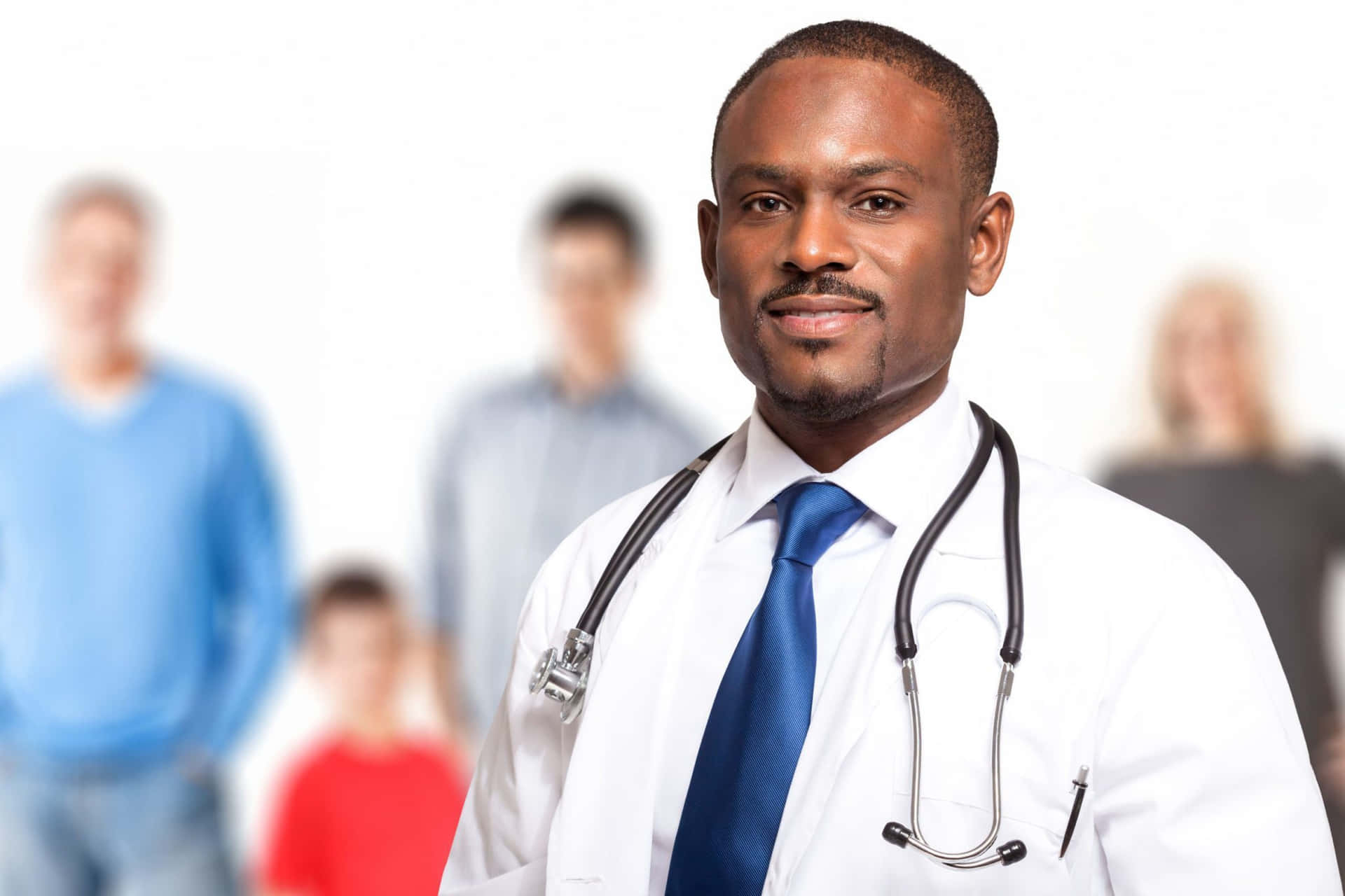 A Doctor With A Stethoscope In Front Of A Group Of People