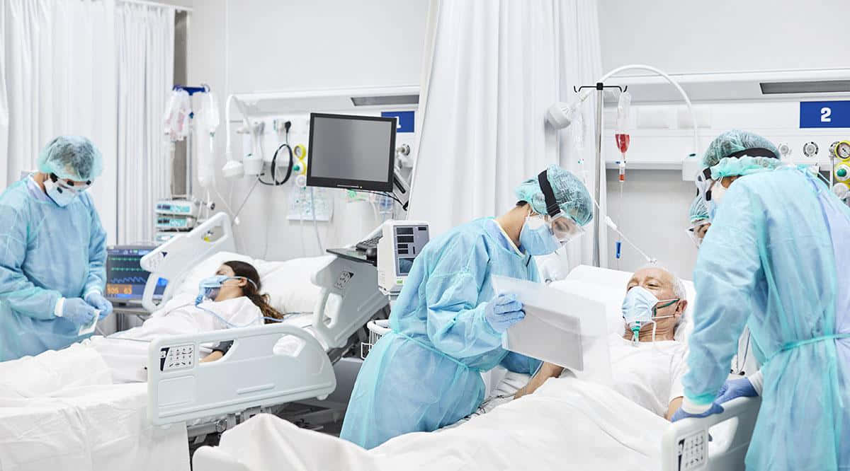 A Group Of People In A Hospital Room