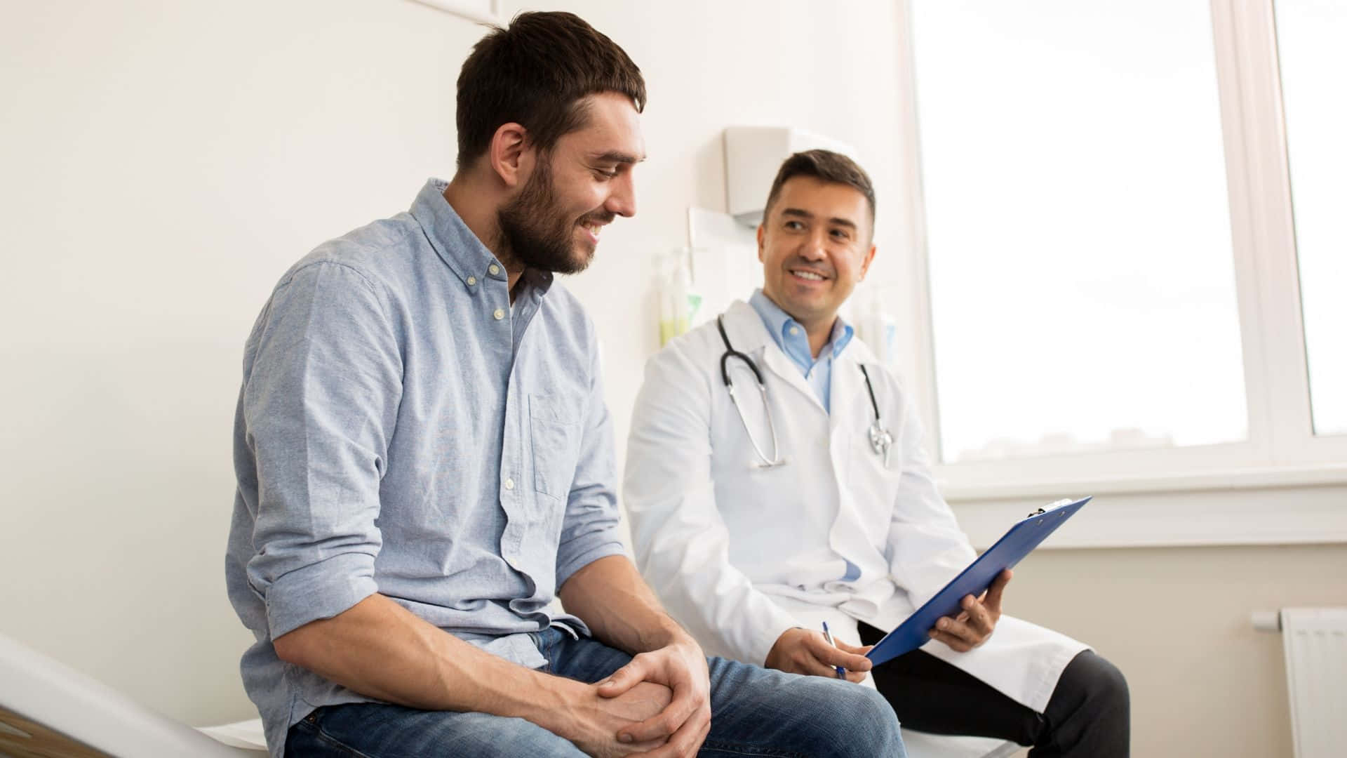 Male Patient Talking To Doctor