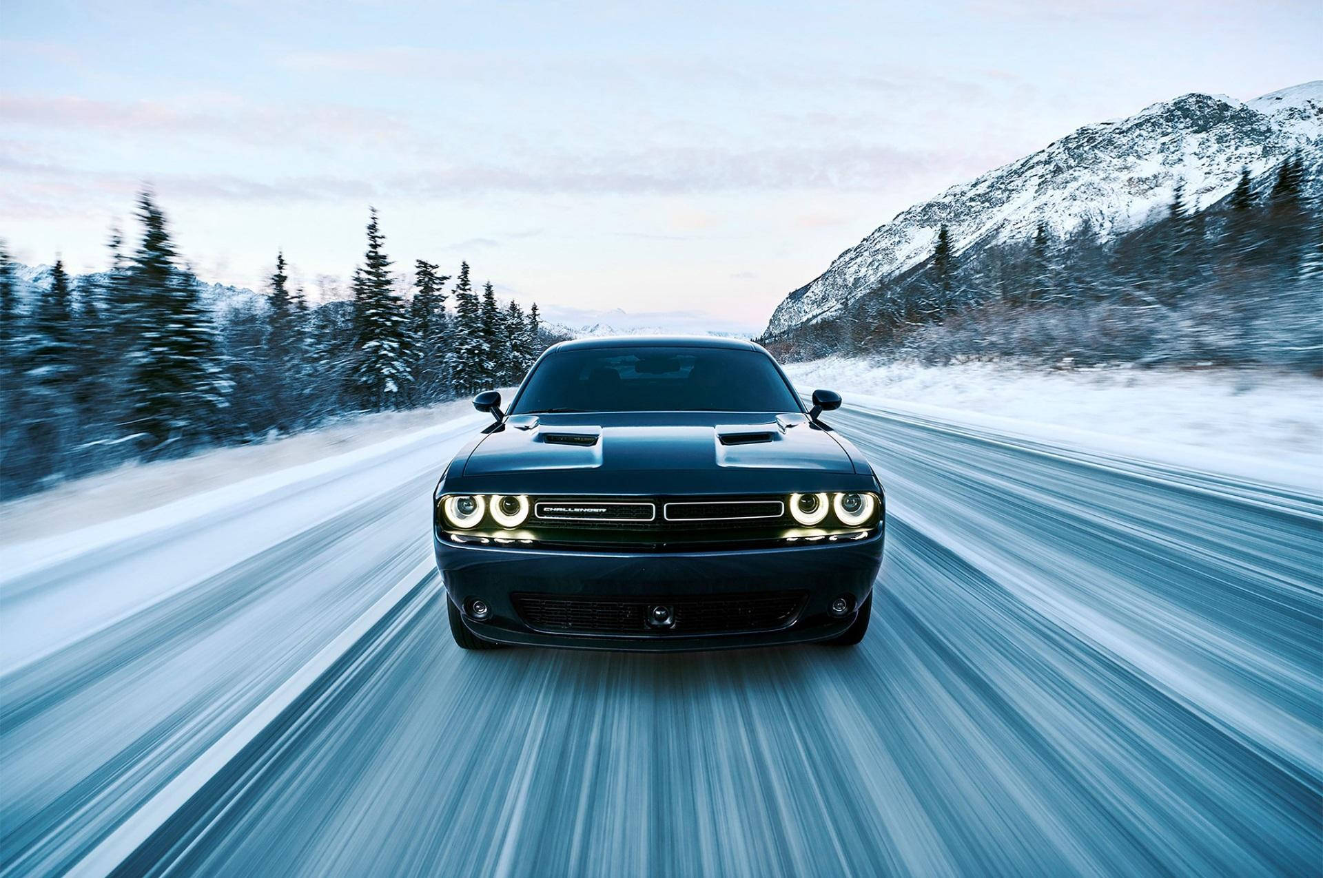 Dodge Challenger In Snowy Road Wallpaper