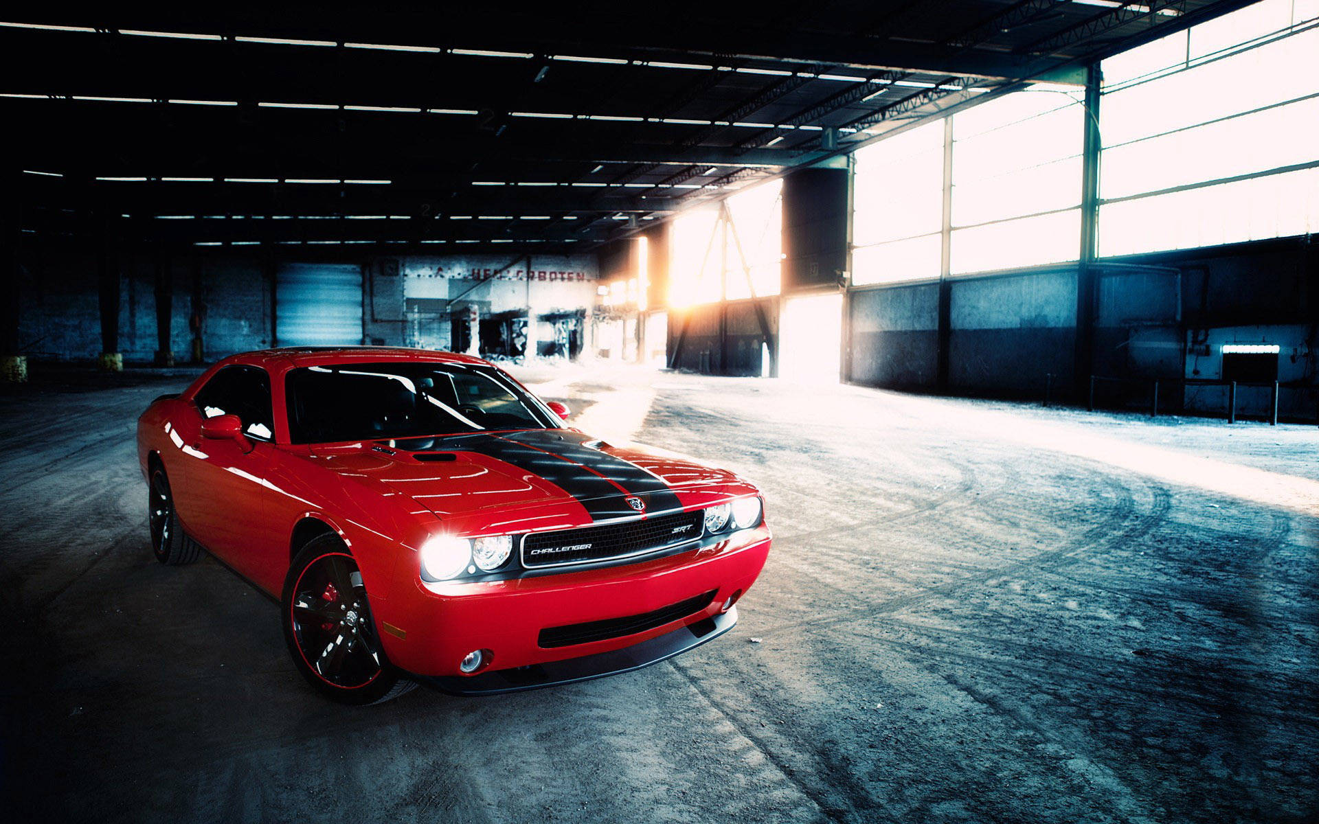 Unleash your wild side with the fierce Dodge Challenger SRT in striking red. Wallpaper
