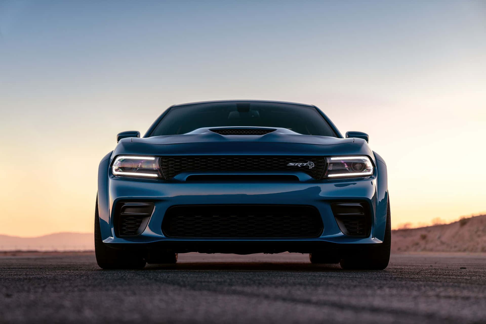 Powerful Dodge Charger cruising down the highway Wallpaper
