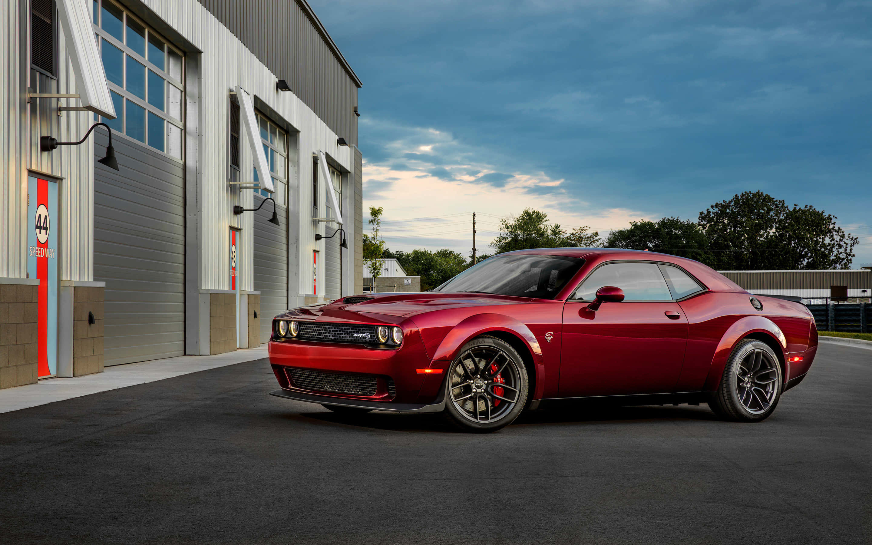 Unleash the Beast: Experience a Powerful and High-Performance Ride with the Dodge Hellcat Wallpaper