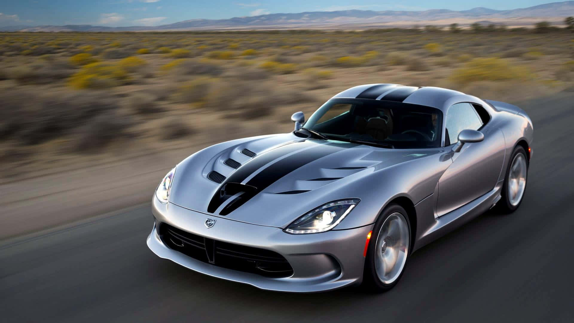 The Powerful and Intense Dodge Viper Thrilling on Roadway Wallpaper