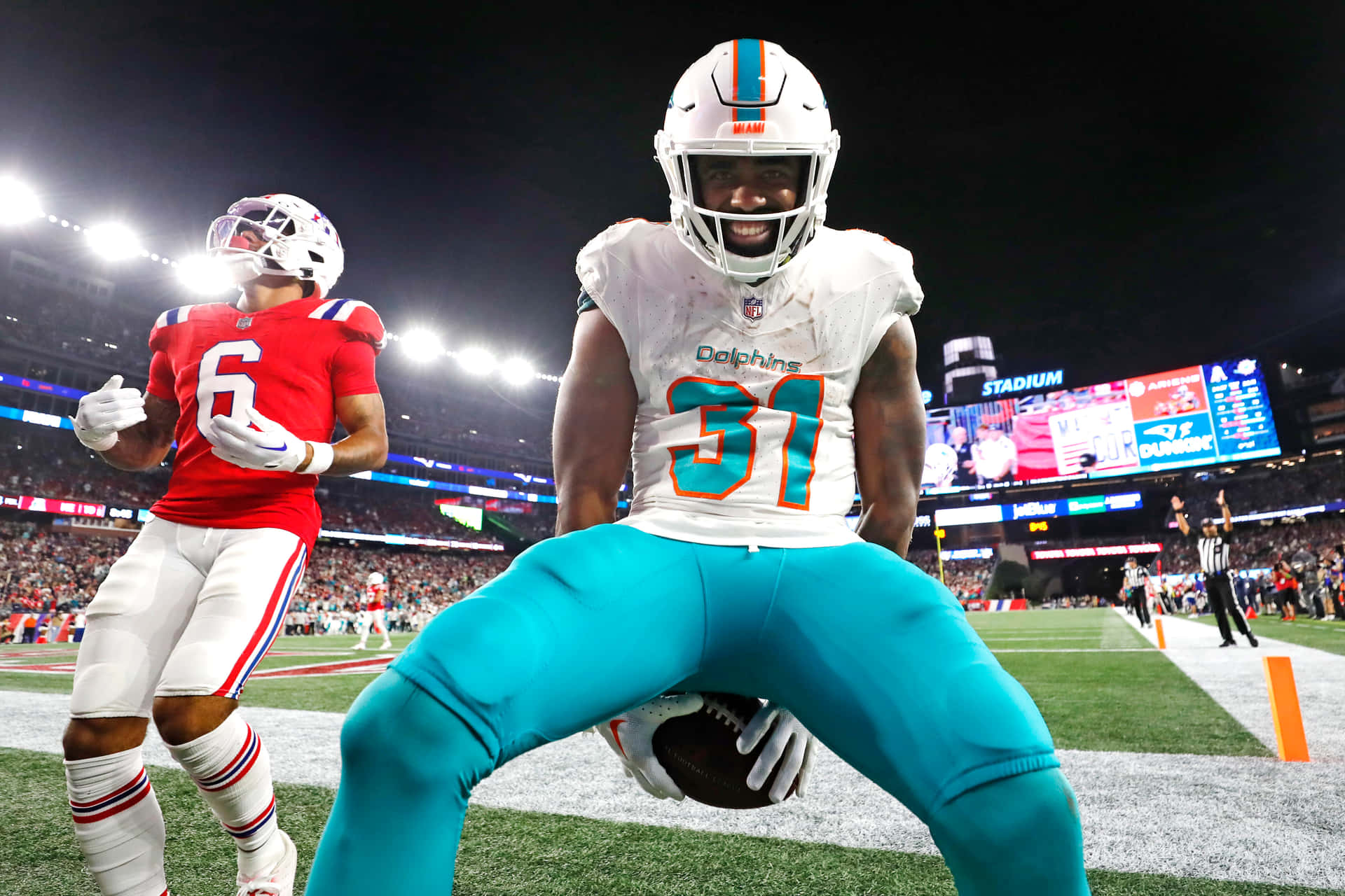 Dolphins Player Celebrationat Night Game Wallpaper