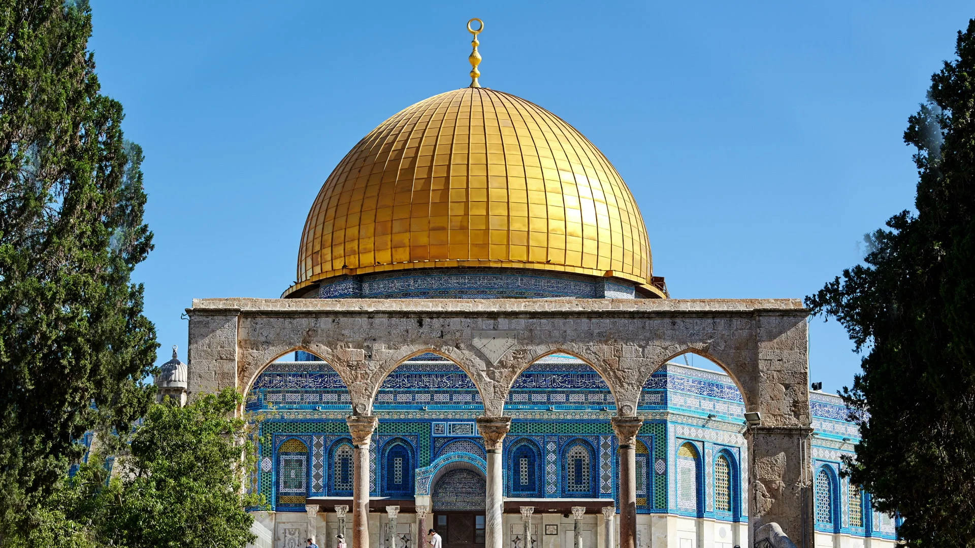 Dome Of The Rock Behind Arches And Foliage Wallpaper