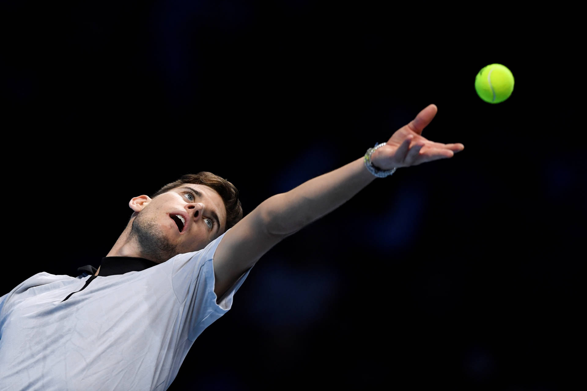 Caption: Professional tennis player Dominic Thiem in action Wallpaper