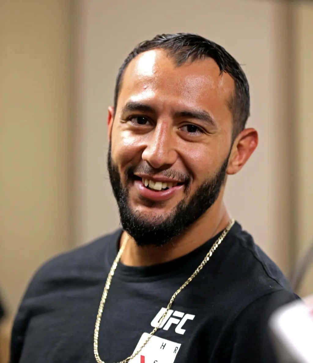 Dominick Reyes Smiling U F C Fighter Wallpaper