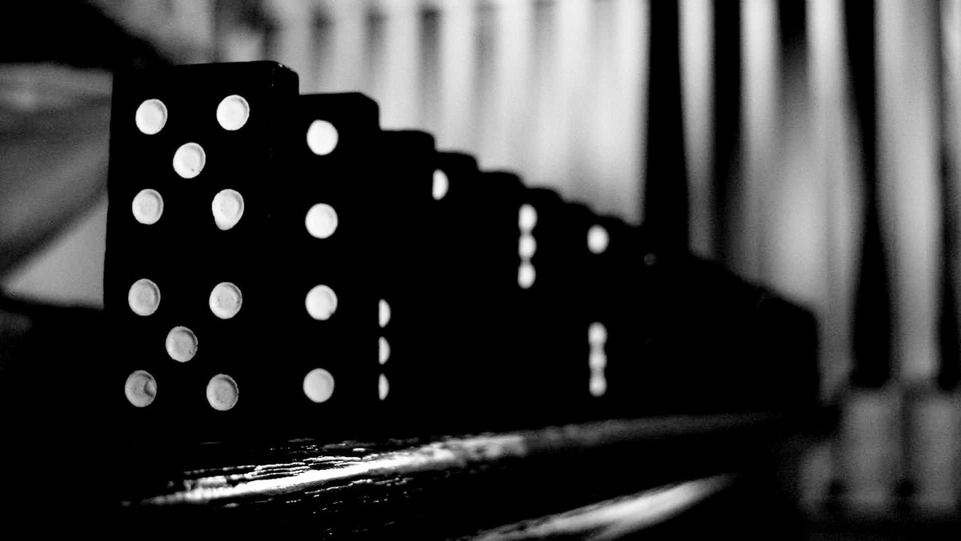 Black and White Dominoes in a Line-Formation