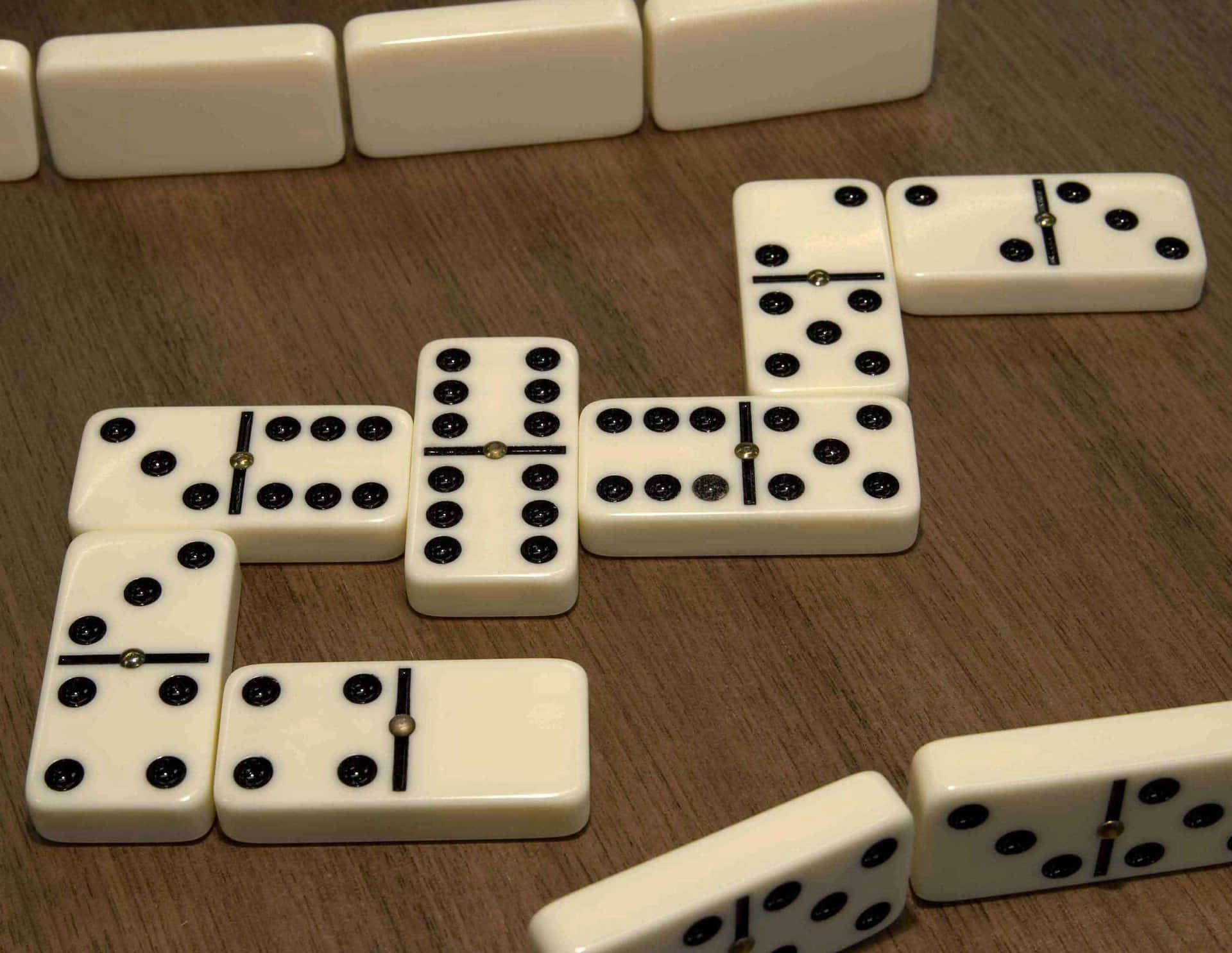 A stack of wooden dominos on a lined background