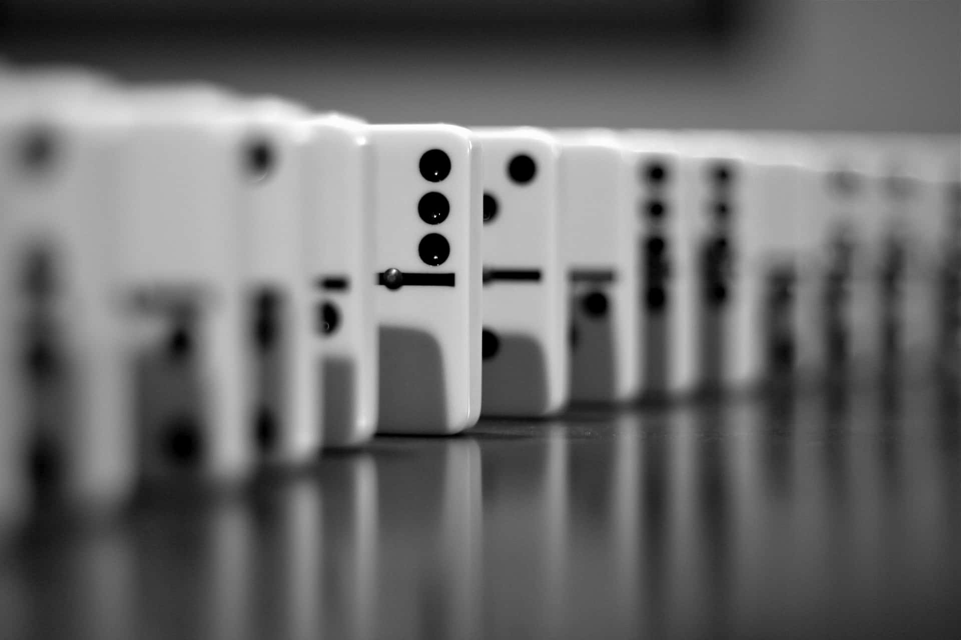 Falling Dominoes in Perfect Alignment