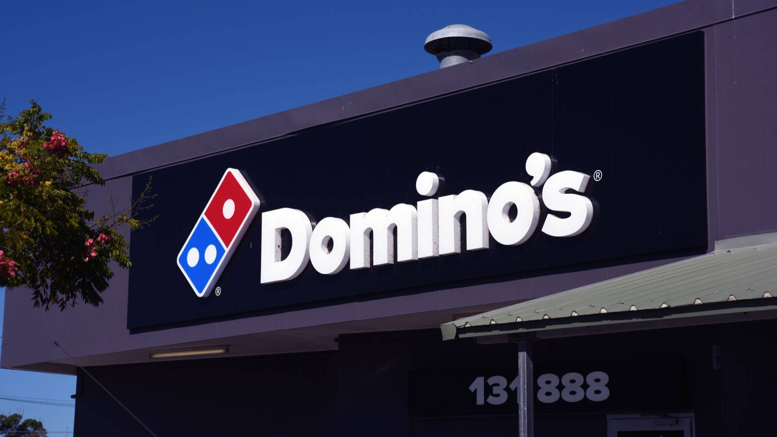 Popular Domino's Pizza Outlet at Night Wallpaper
