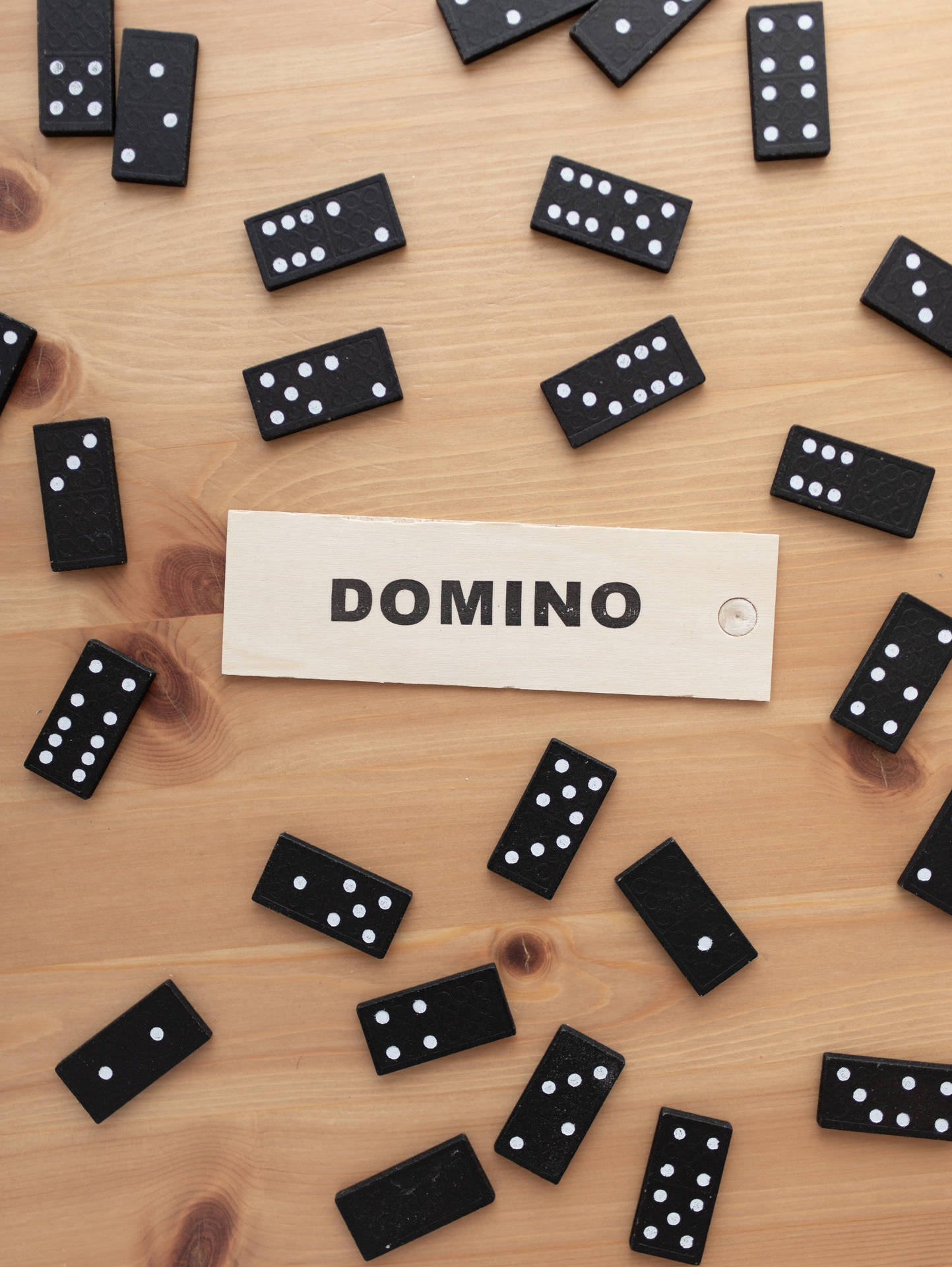 Dominos Scattered On Table Wallpaper