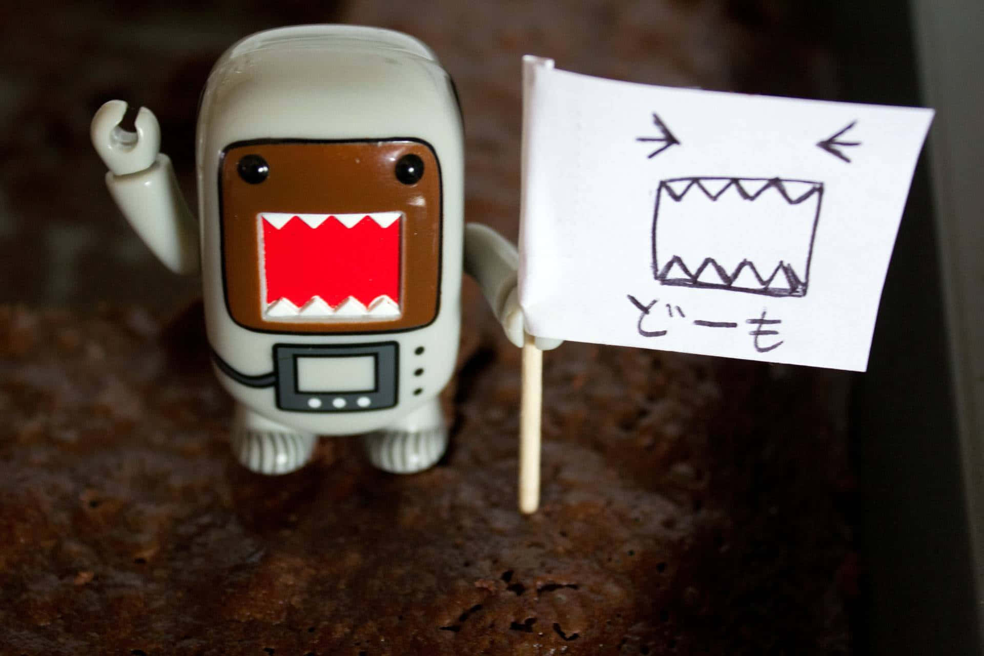 Domo Kun Toy Holding Sign Wallpaper