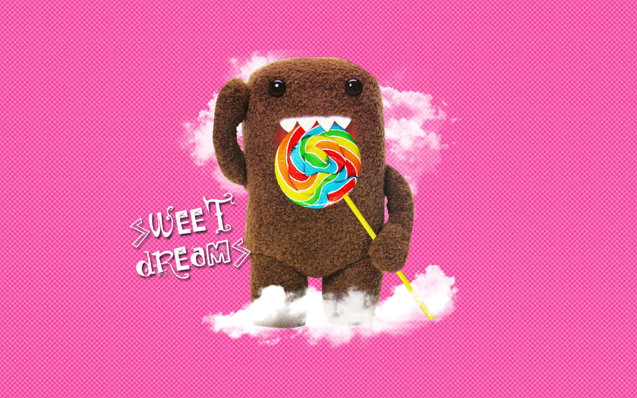 Domo With Lollipop On Pink Background Wallpaper