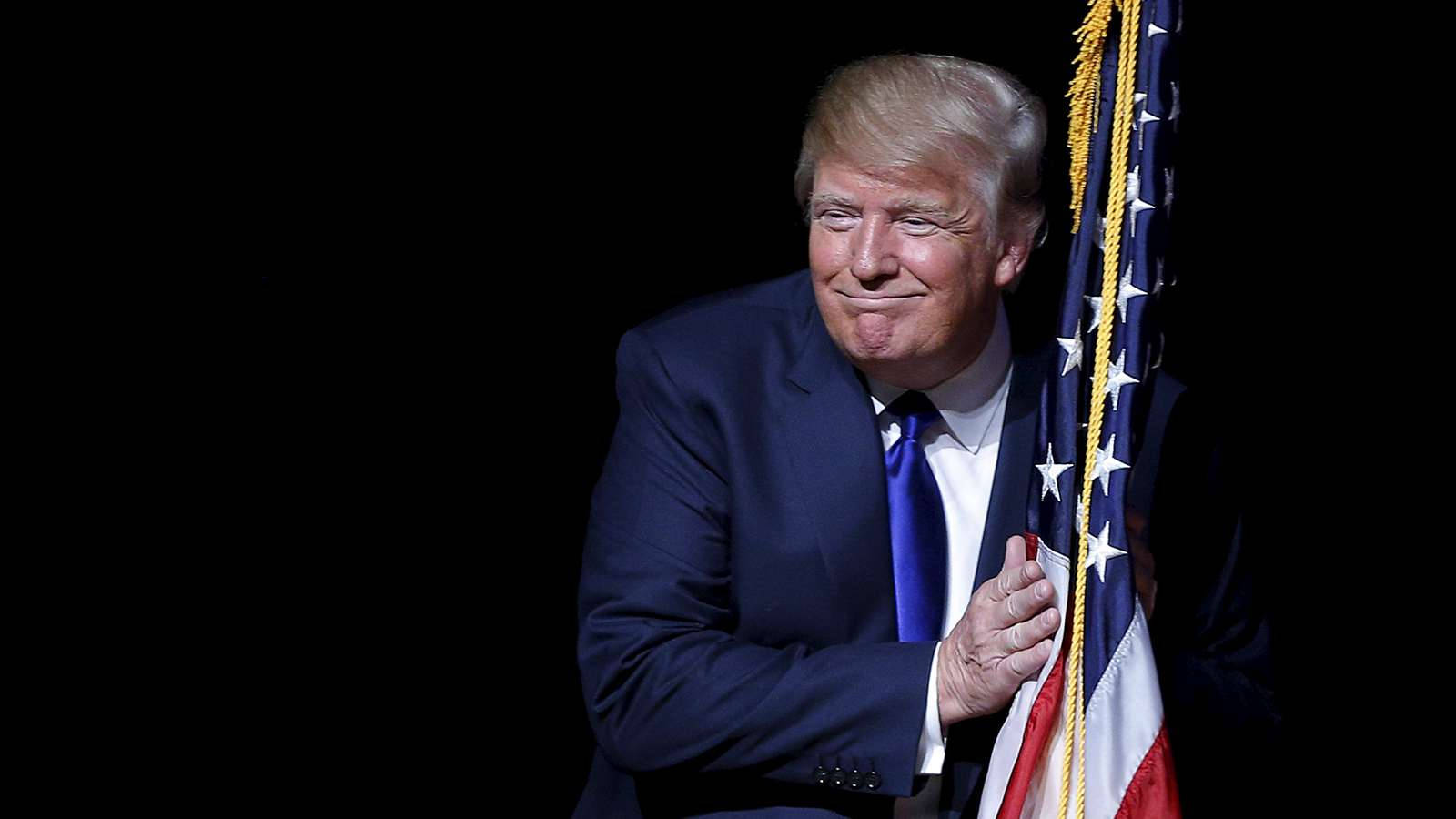 Donald Trump Hugging American Flag Wallpaper