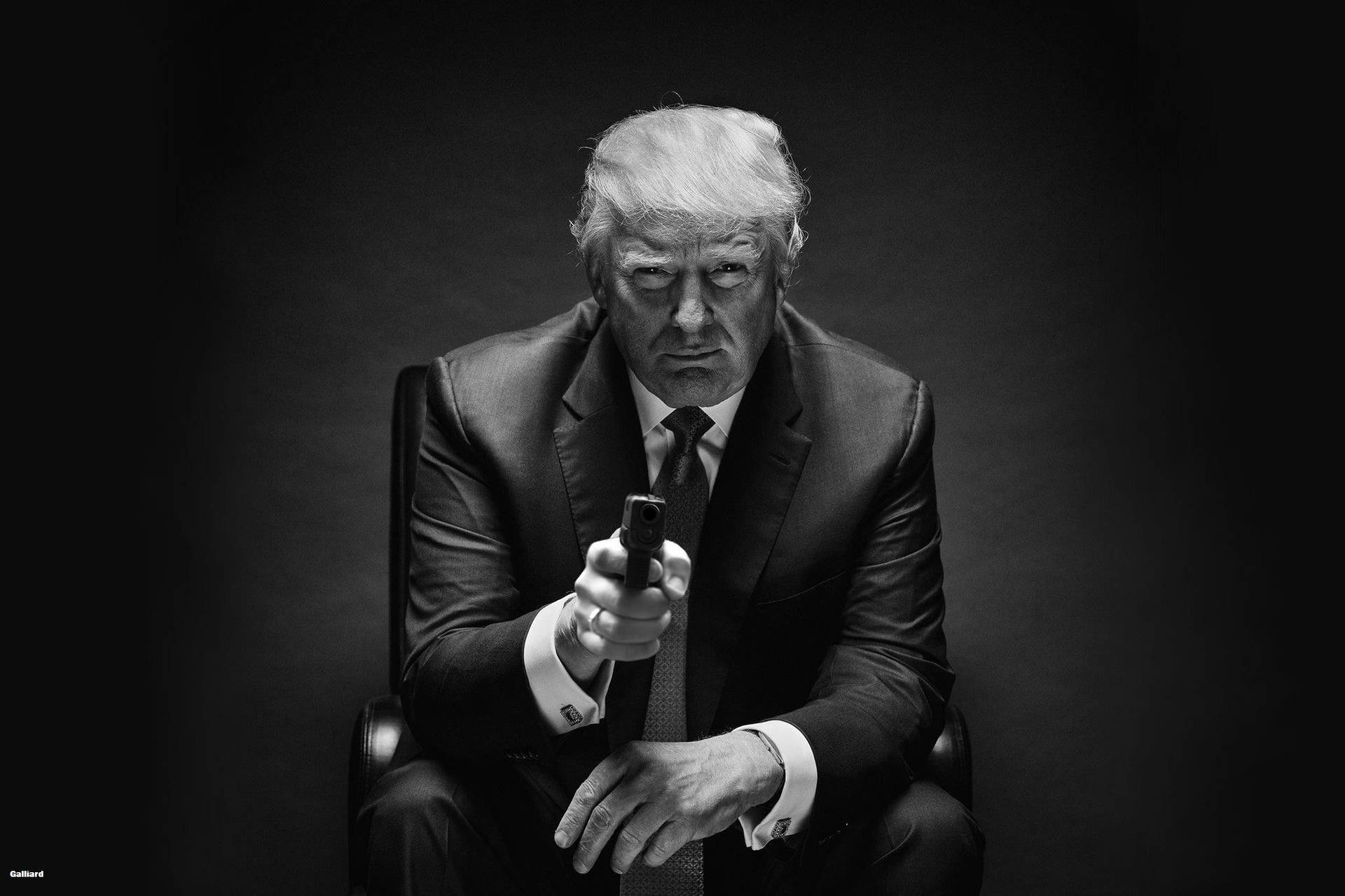 Black and white wallpaper of Donald Trump pointing a gun