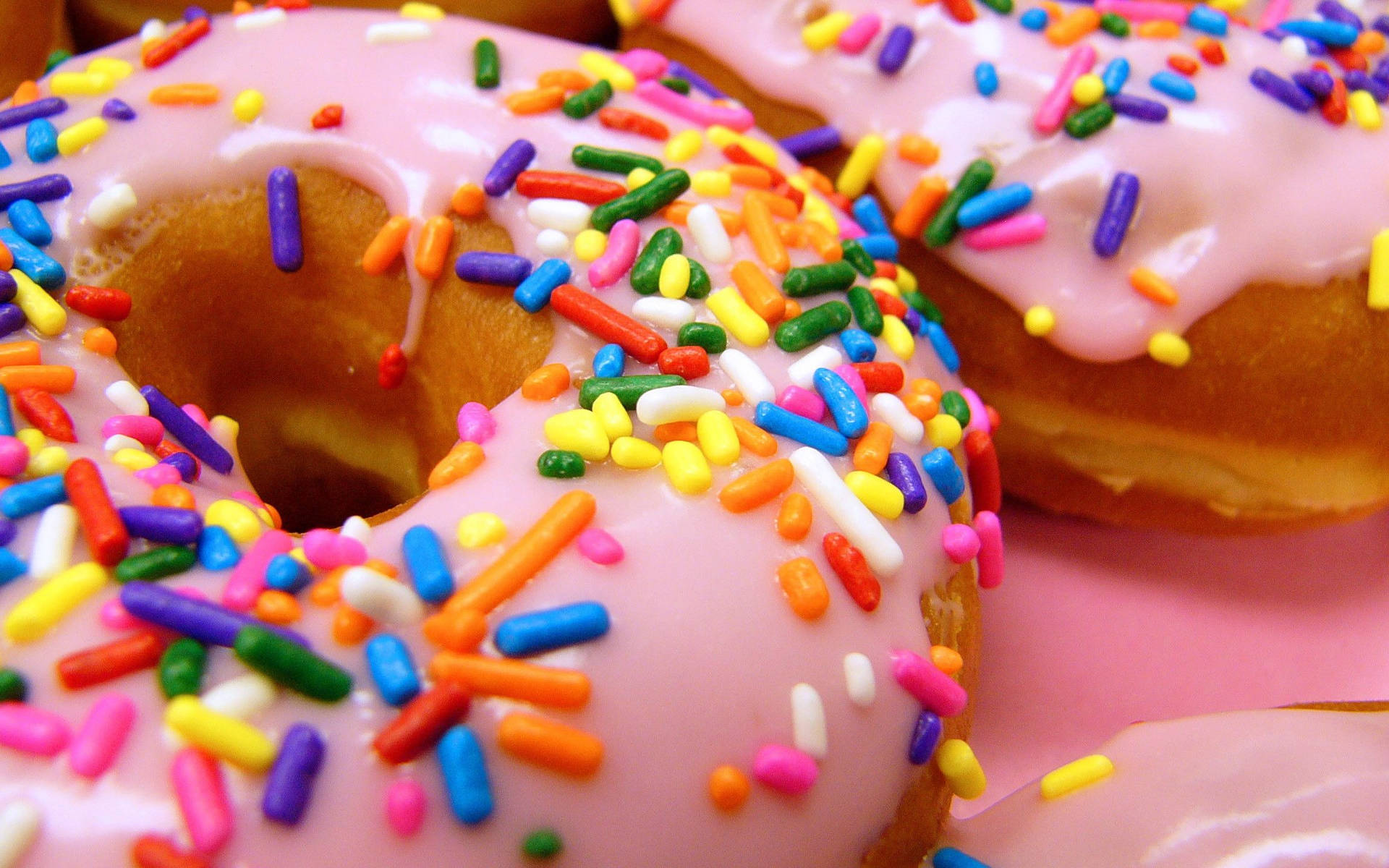 Donuts Med Candy Sprinkles Wallpaper