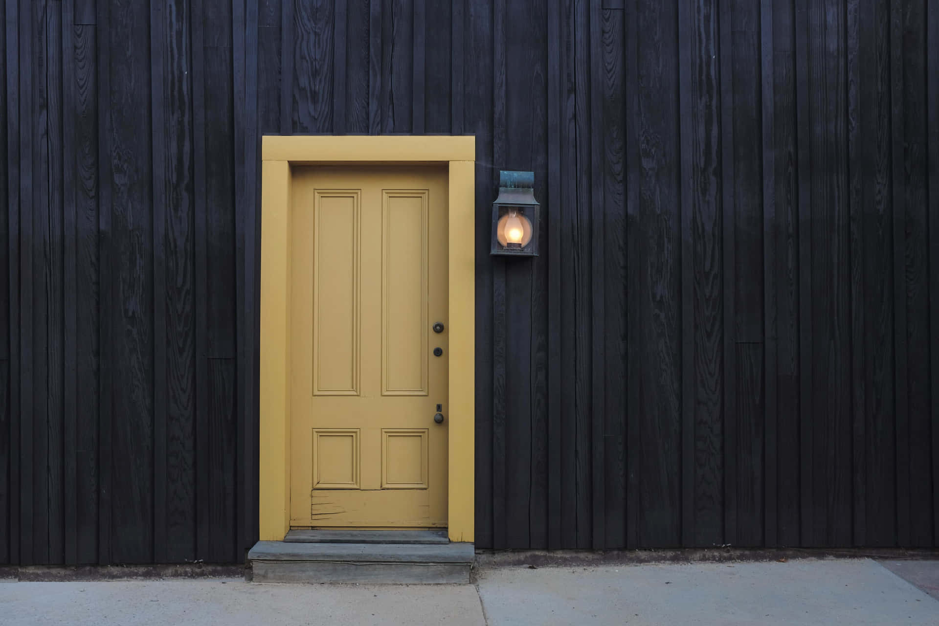 A Yellow Door On A Black Wall