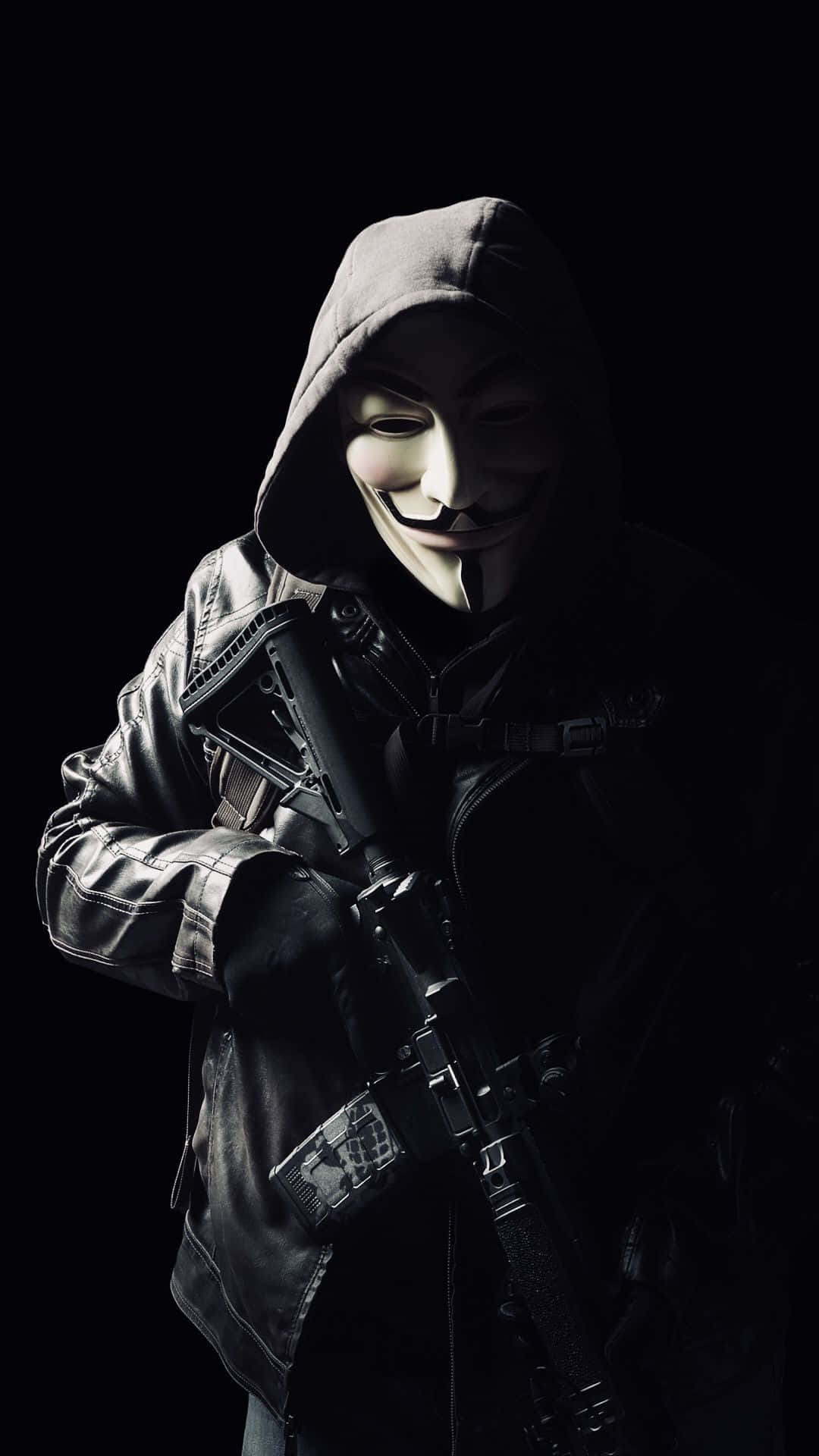 A Man In A Mask Holding A Gun Wallpaper
