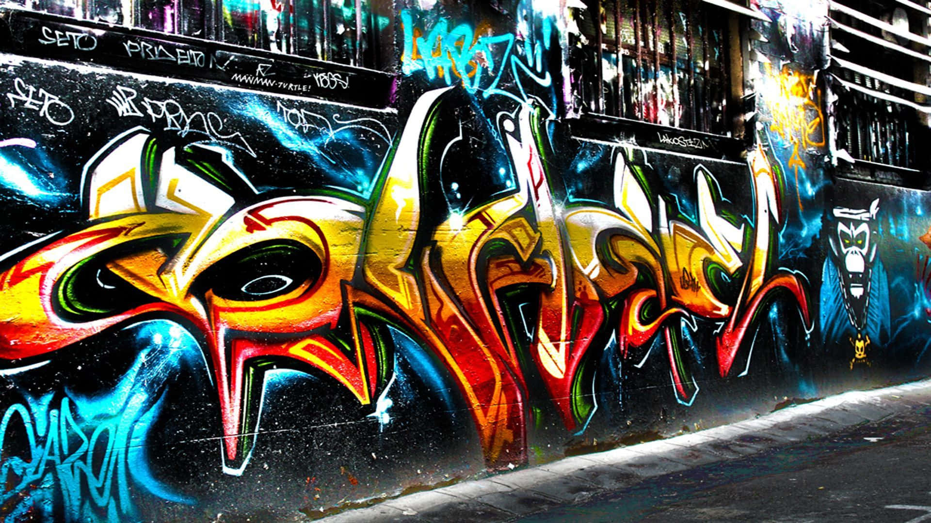 A creative street art wall with a colourful graffiti Wallpaper