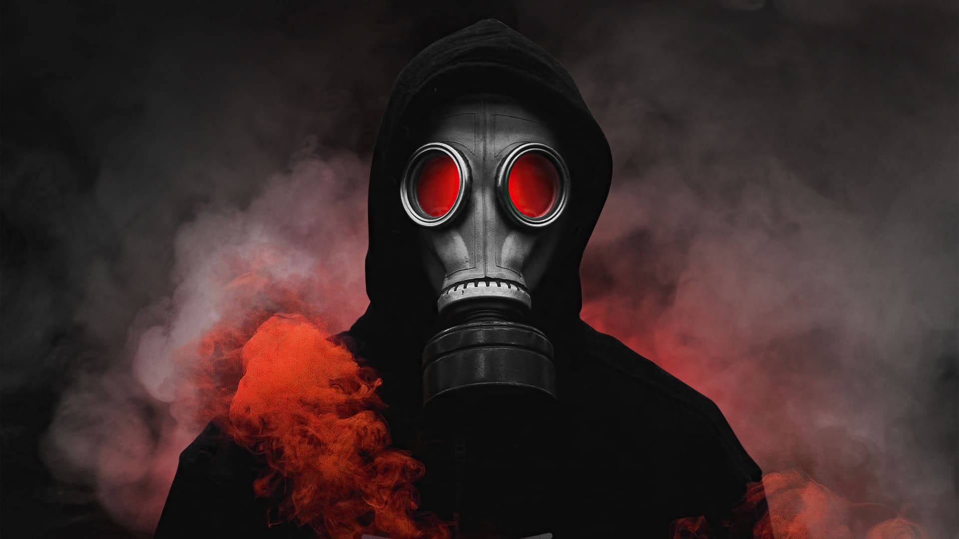 A Man In A Gas Mask With Red Eyes Wallpaper
