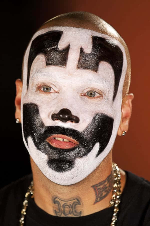 A Man With A Black And White Face Paint