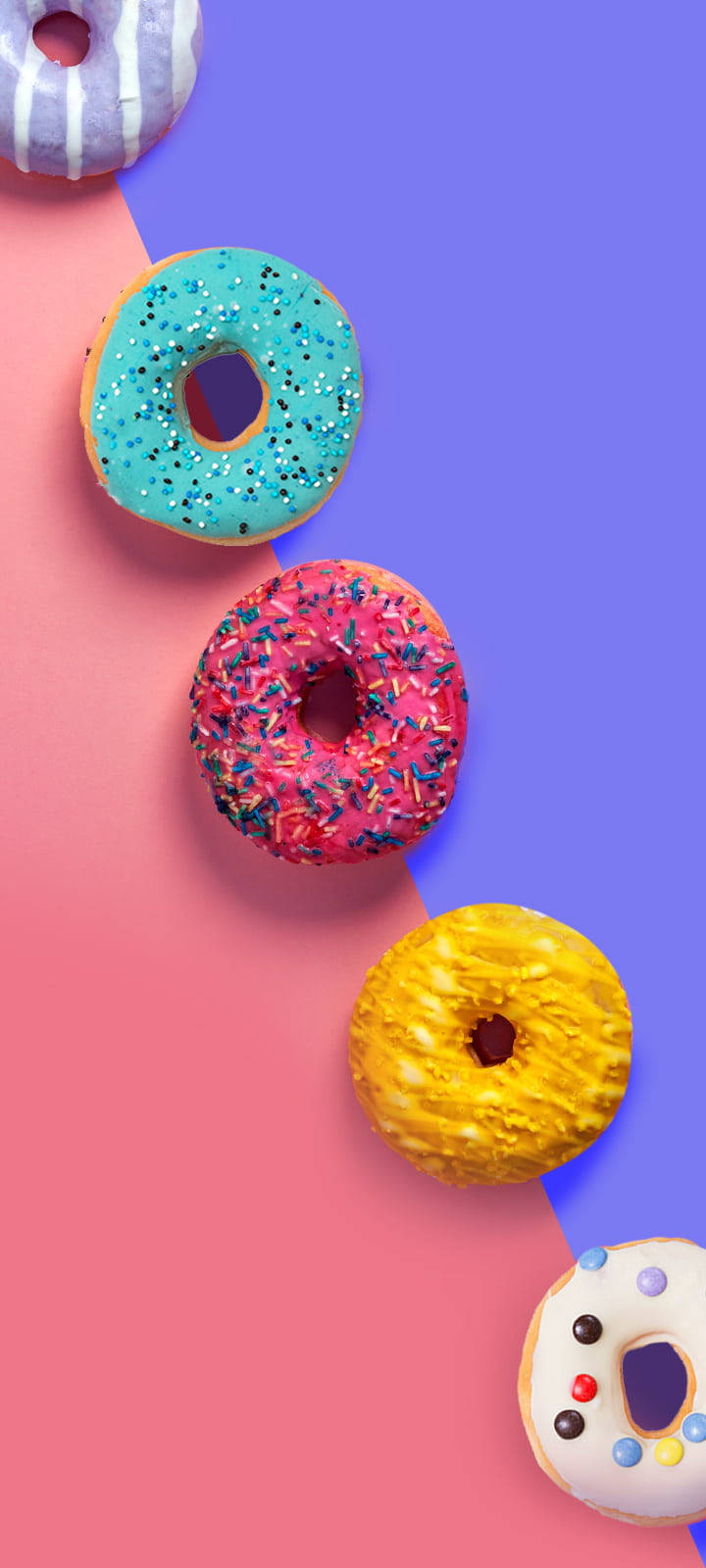 Punkteinschnittleckere Bunte Donuts Wallpaper