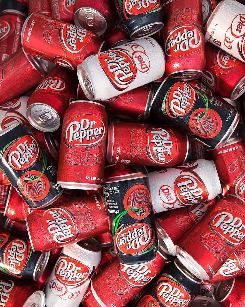 A Pile Of Red And White Cans Of Soda Wallpaper