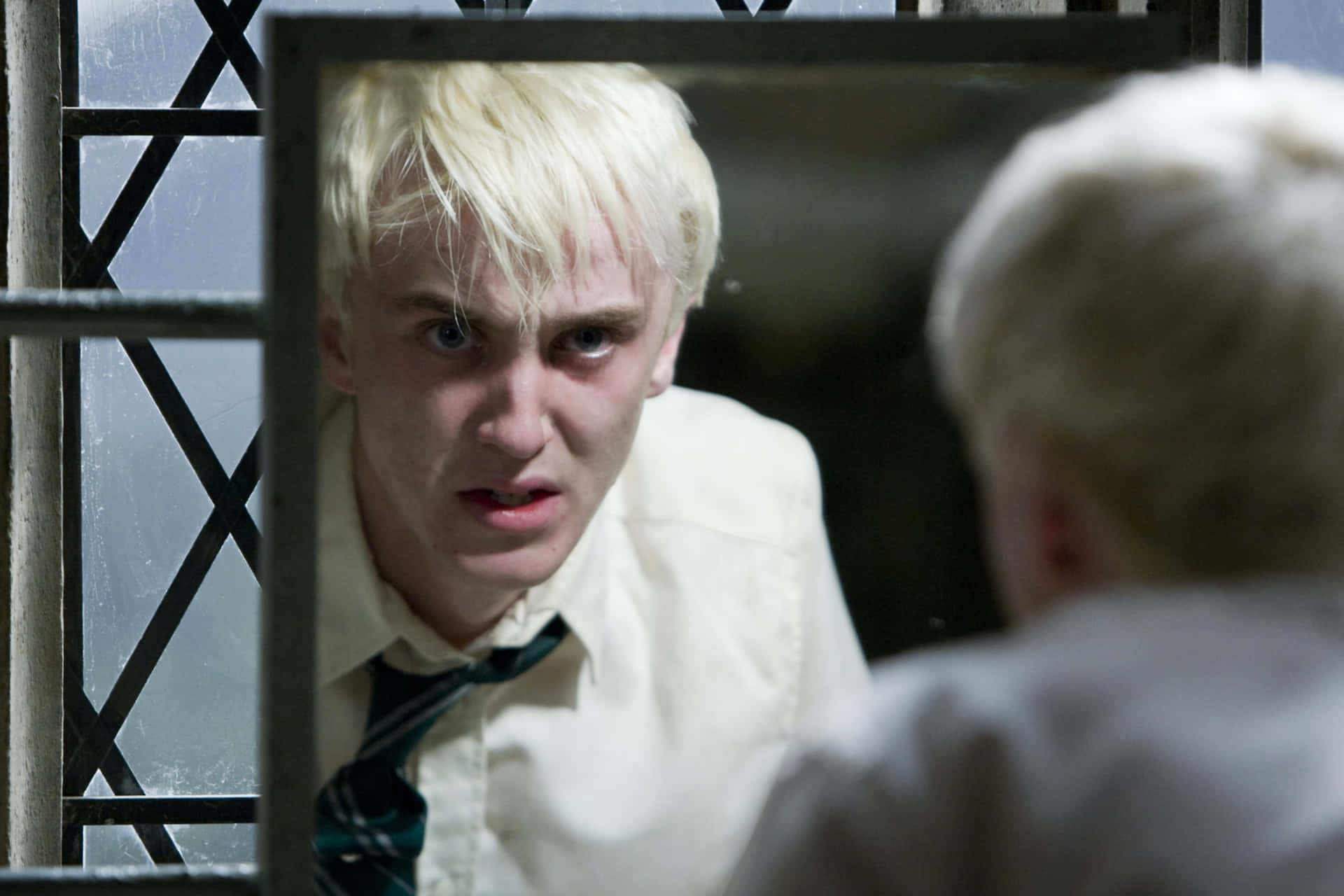 Draco Malfoy making a witty comment at Hogwarts