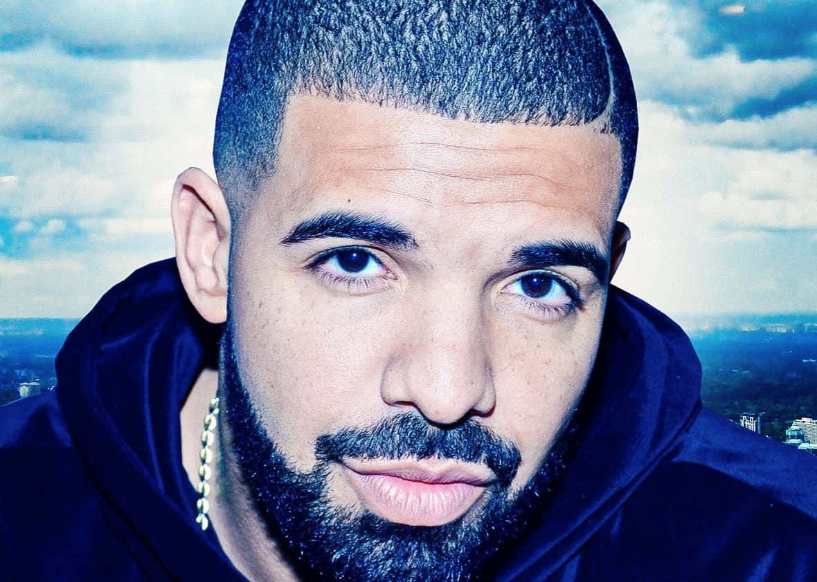 Grammy-Award winning artist, Drake, captured in a captivating music moment.
