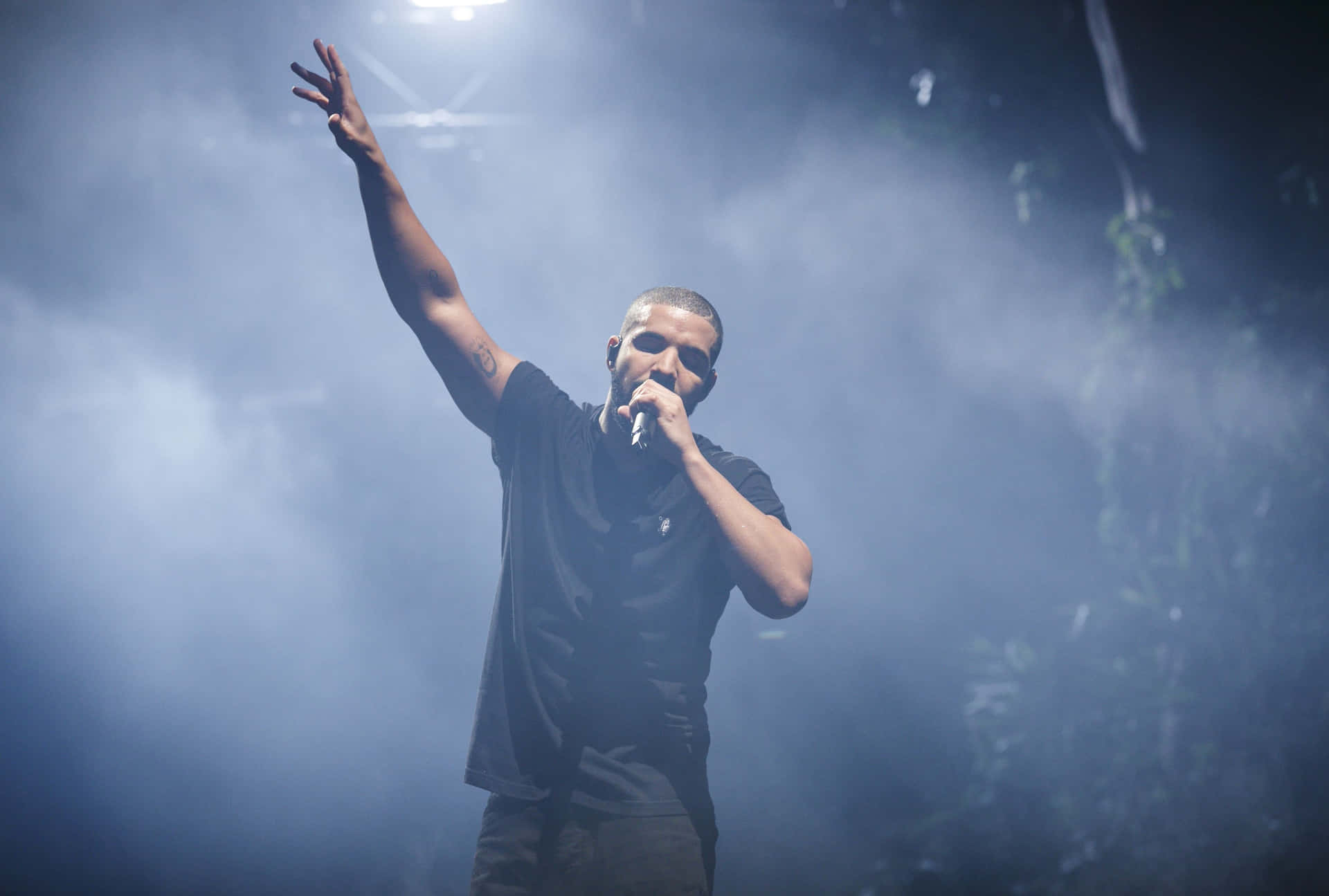 Caption: Award-winning artist Drake performing live on stage