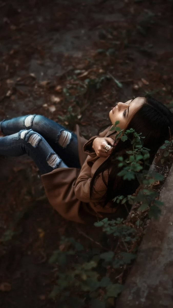 Dramatic Girl Sitting In Forest Alone Wallpaper