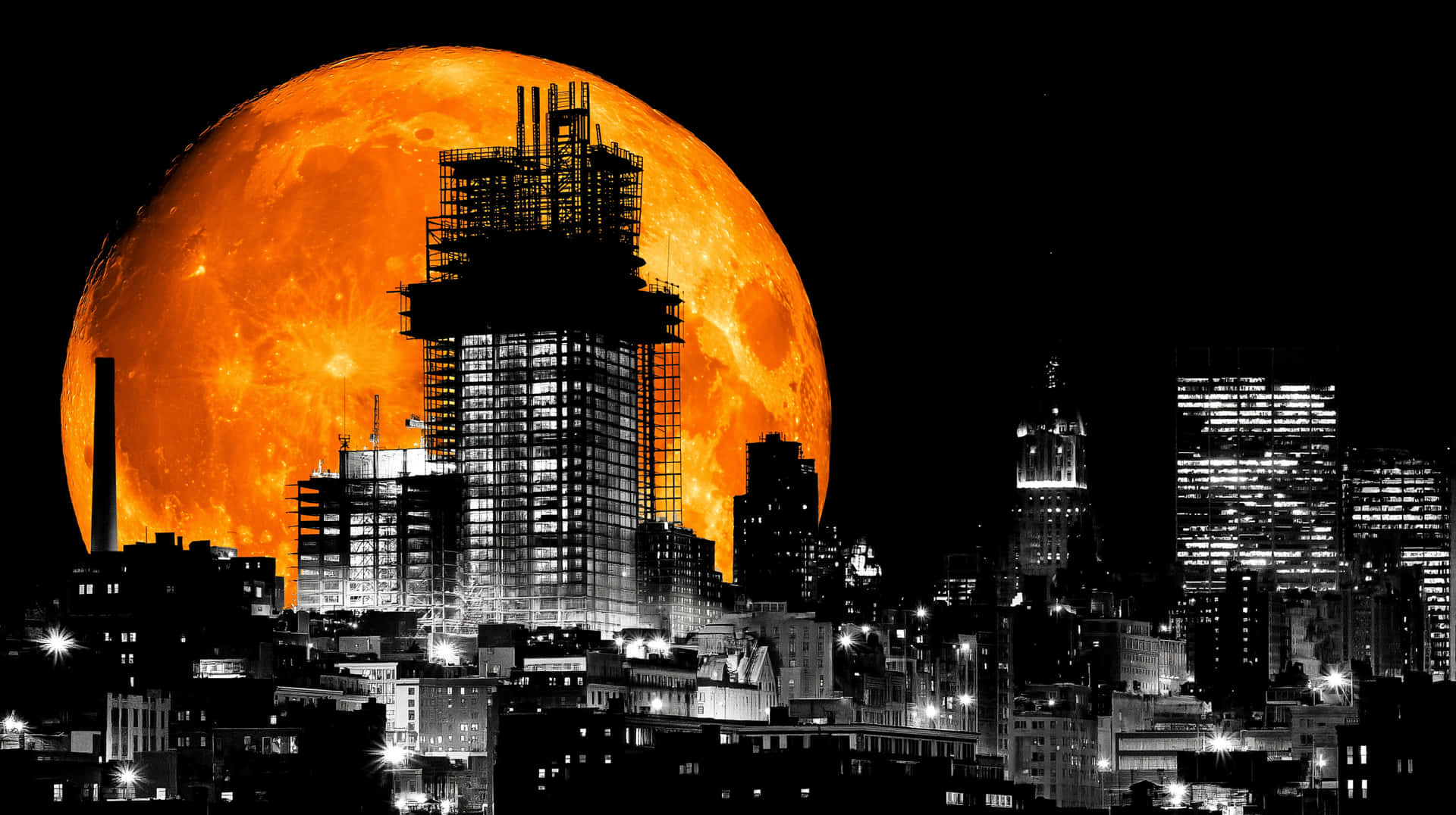 Dramatic Orange Moon Over Monochromatic City Skyline Wallpaper