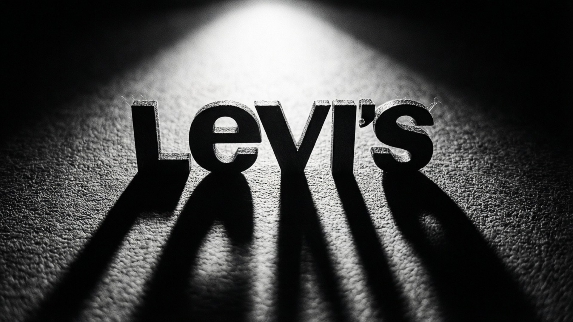 Levi's logo med dramatisk belysning og skygger