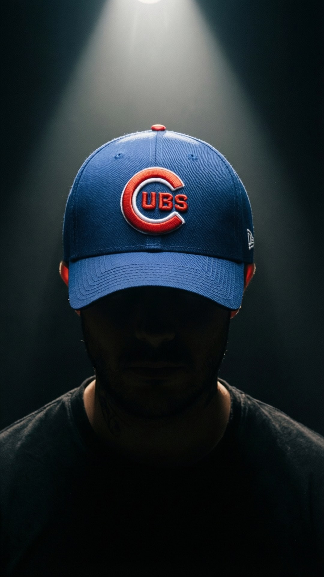 An artistic wallpaper of a Cubs cap with dramatic lighting.