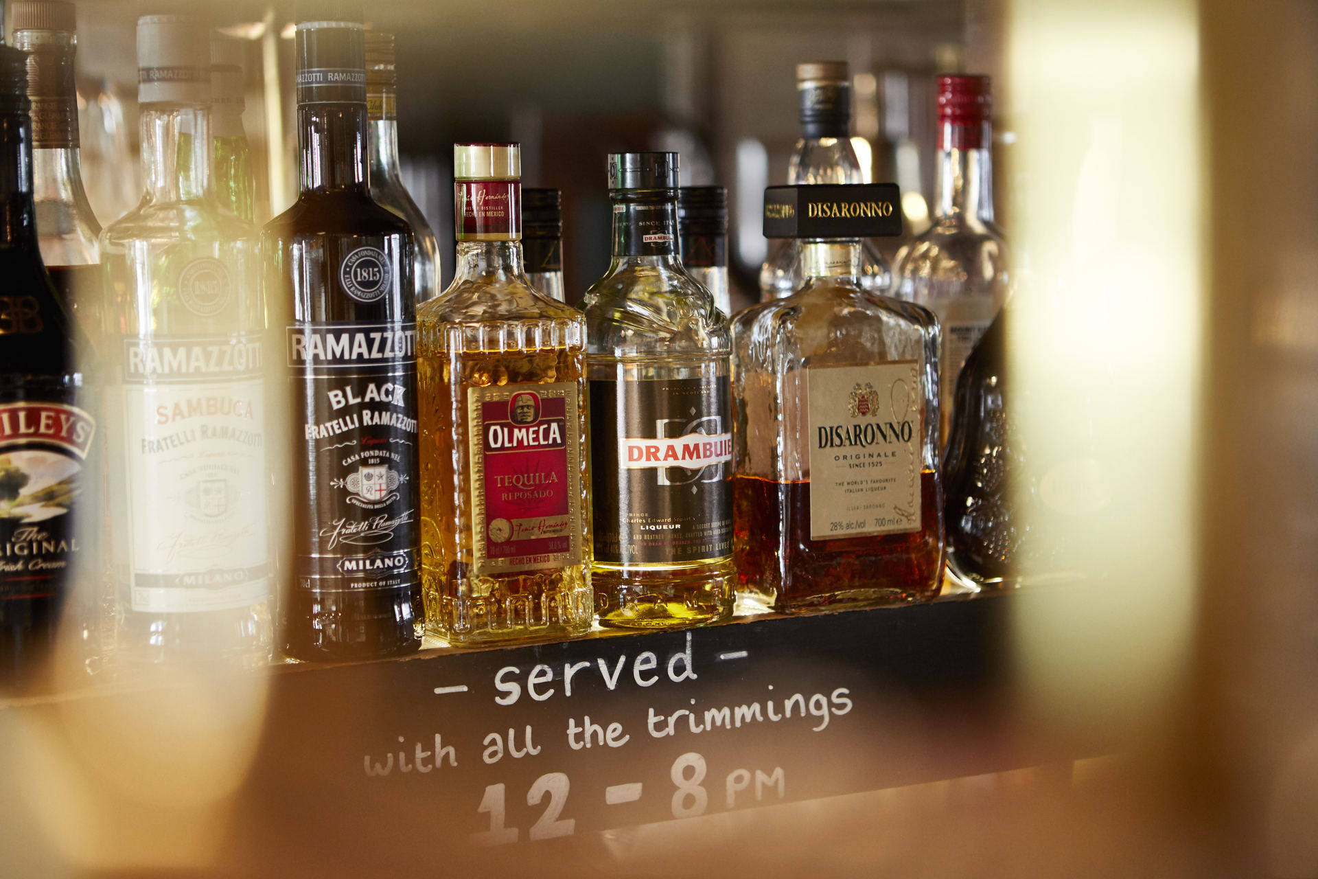 Exquisite Display of Drambuie and Other Finely Crafted Spirits Wallpaper