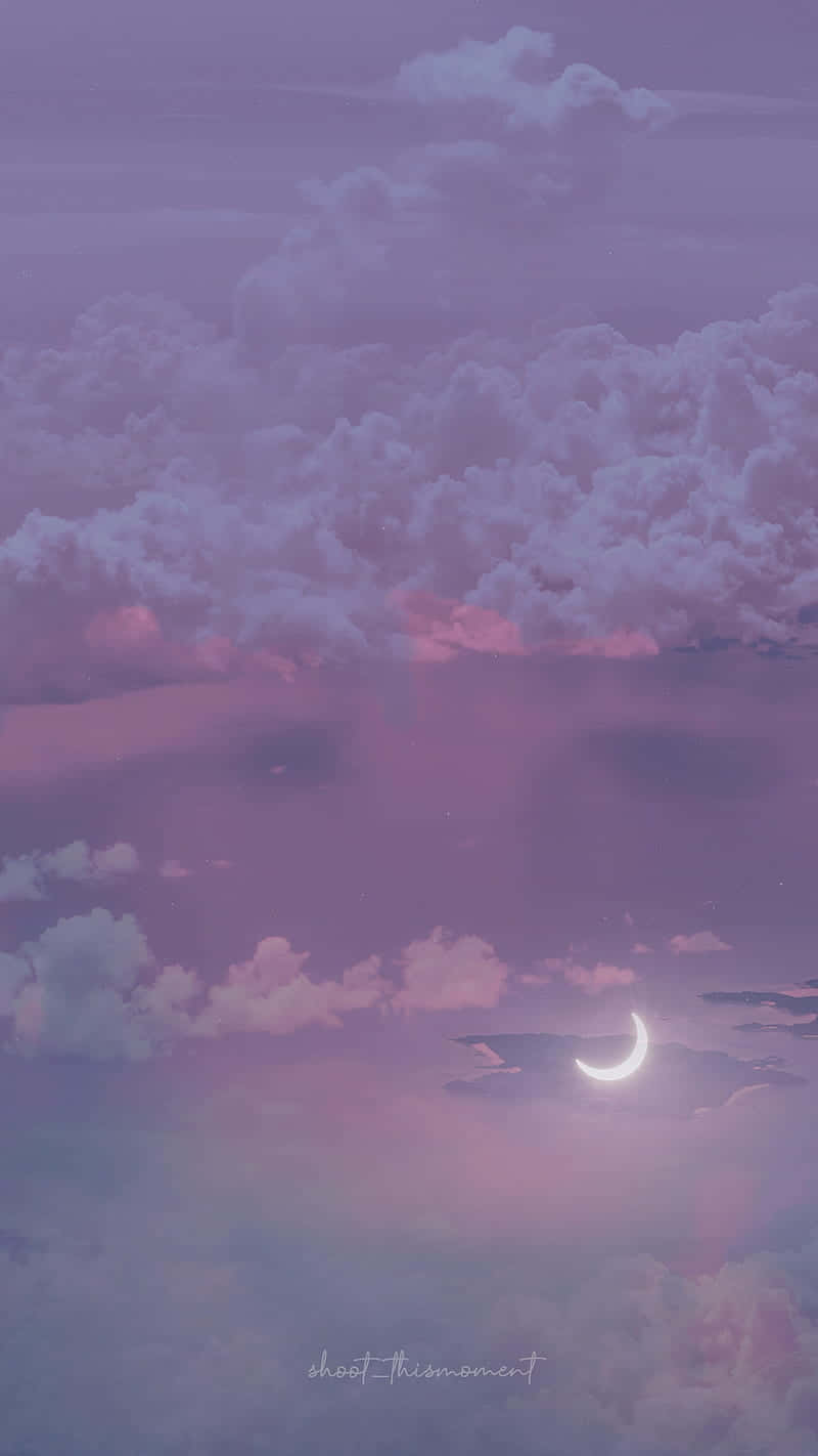 Download A Purple Sky With Clouds And A Crescent Wallpaper | Wallpapers.com