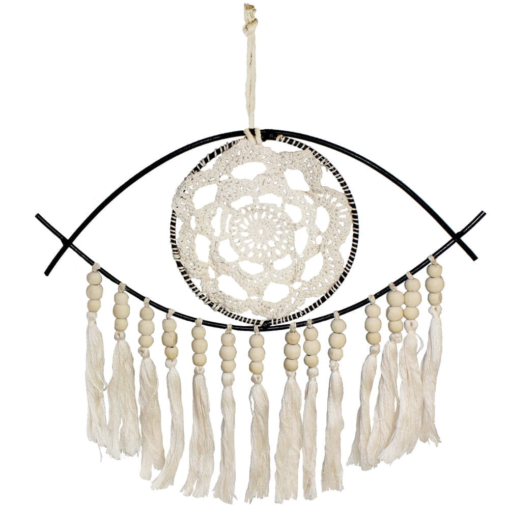 A Hanging Dream Catcher With Tassels And A White Eye
