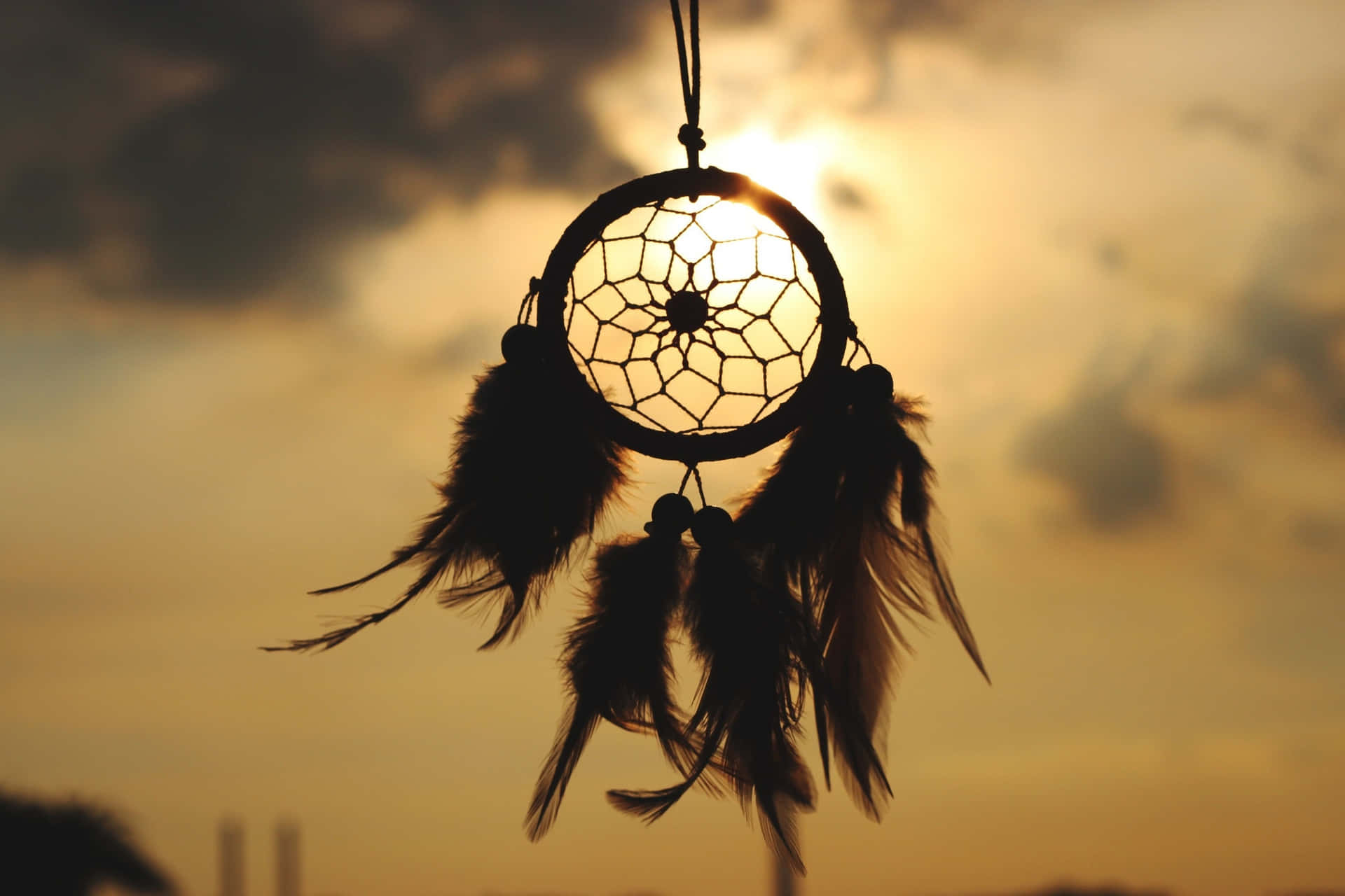 A Dream Catcher Hanging From The Sky
