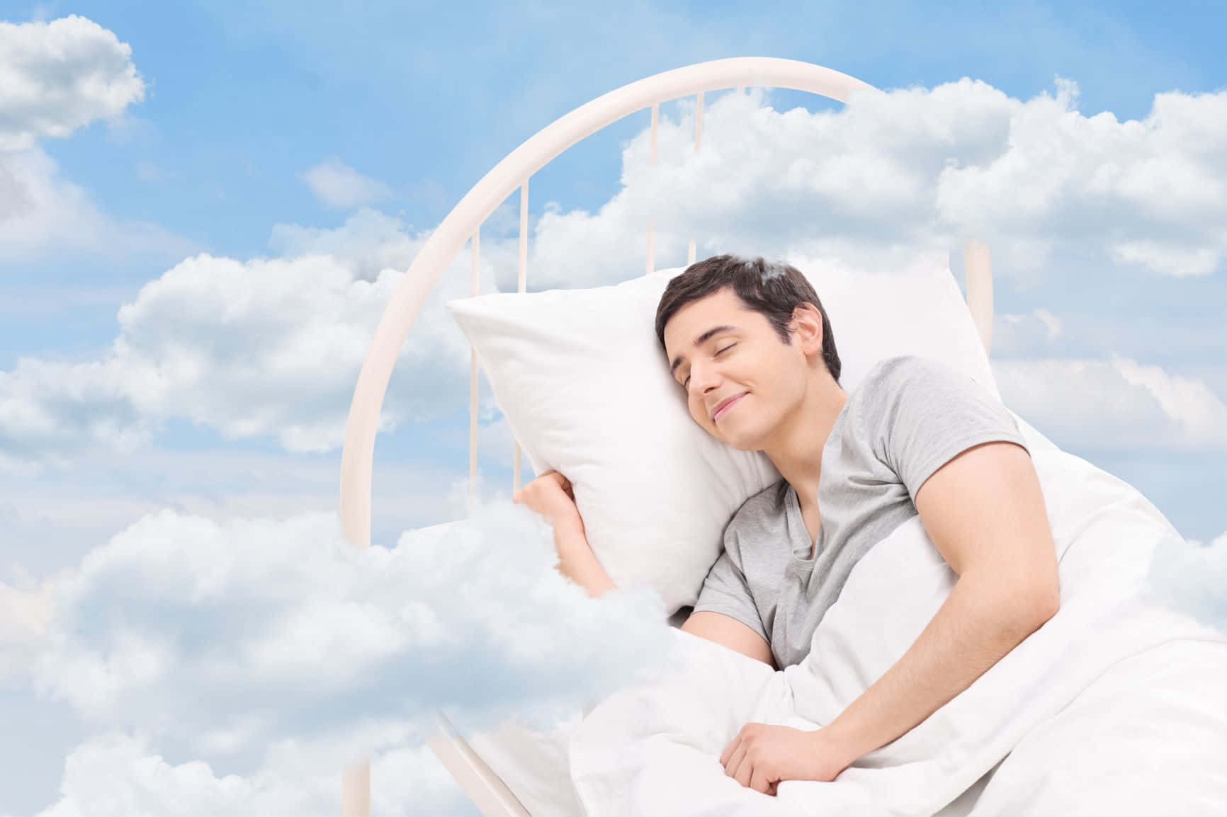 Man Sleeping In A Bed With Clouds
