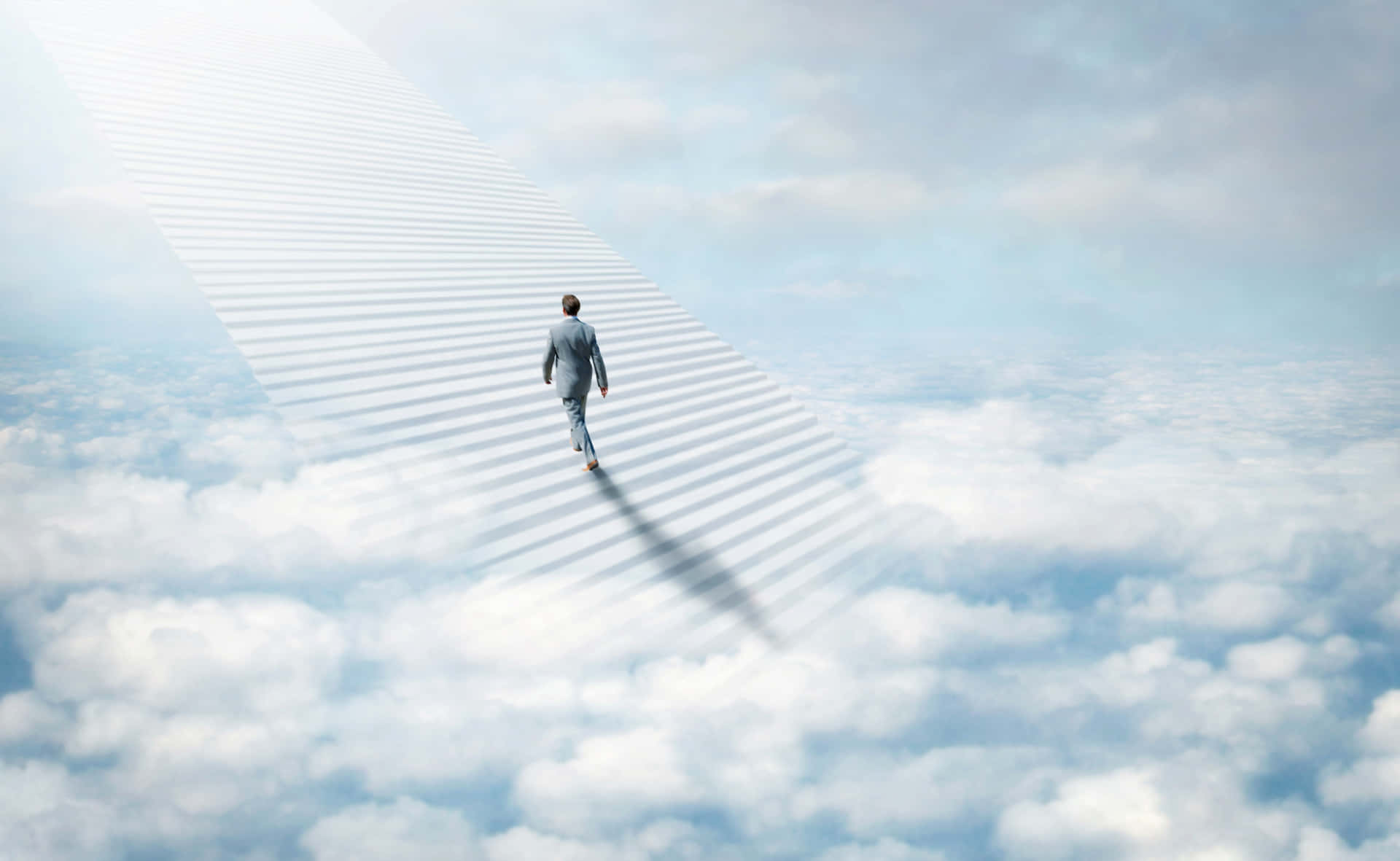 A Businessman Walking On A Path In The Clouds