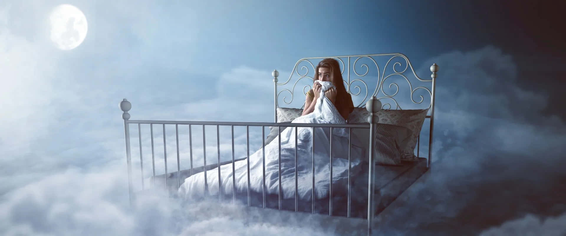 A Woman Is Sitting In A Bed In The Clouds
