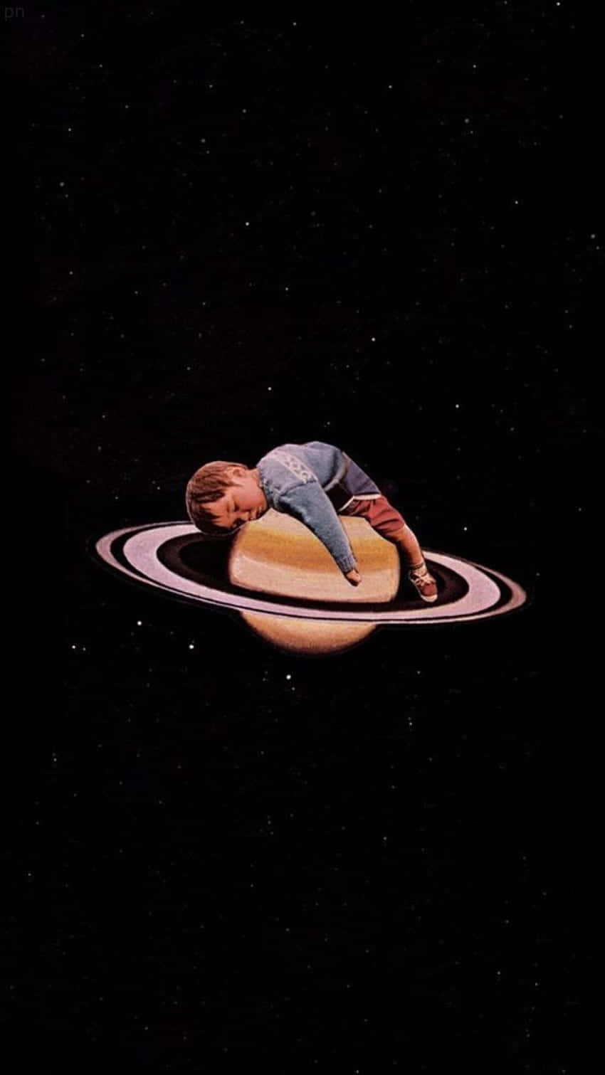 Dreamy Space Child Restingon Saturn Ring Wallpaper