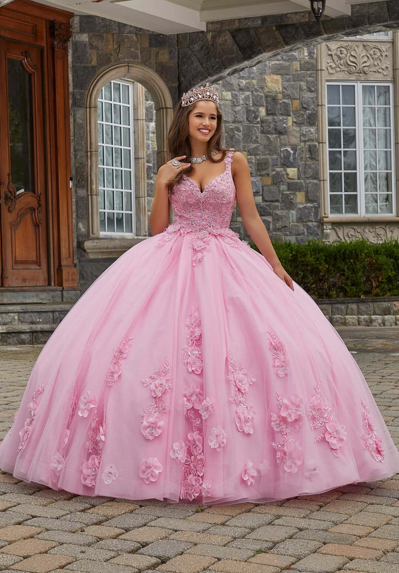 A Young Girl In A Pink Quinceanera Dress