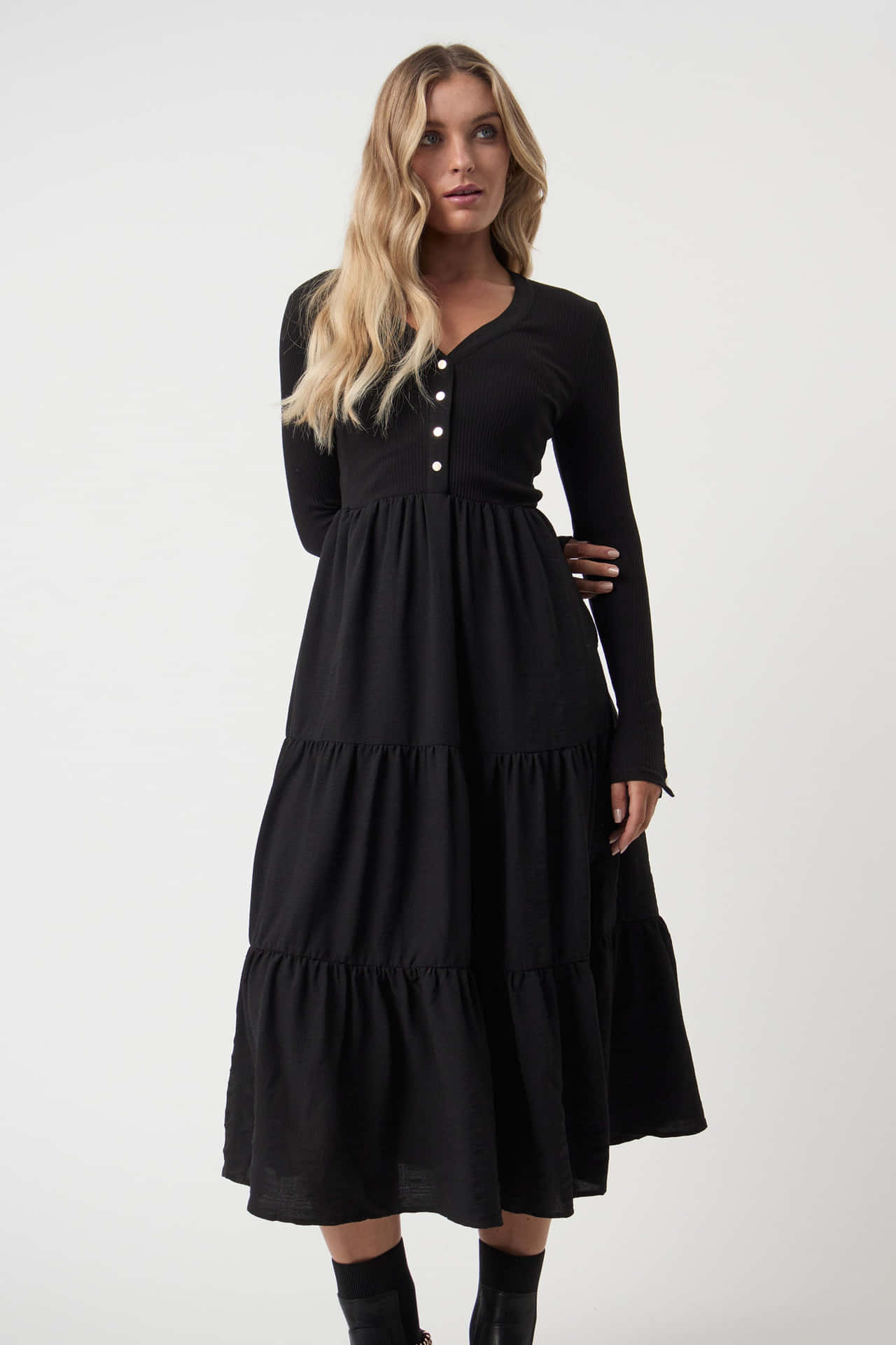 A Woman Wearing A Black Tiered Dress