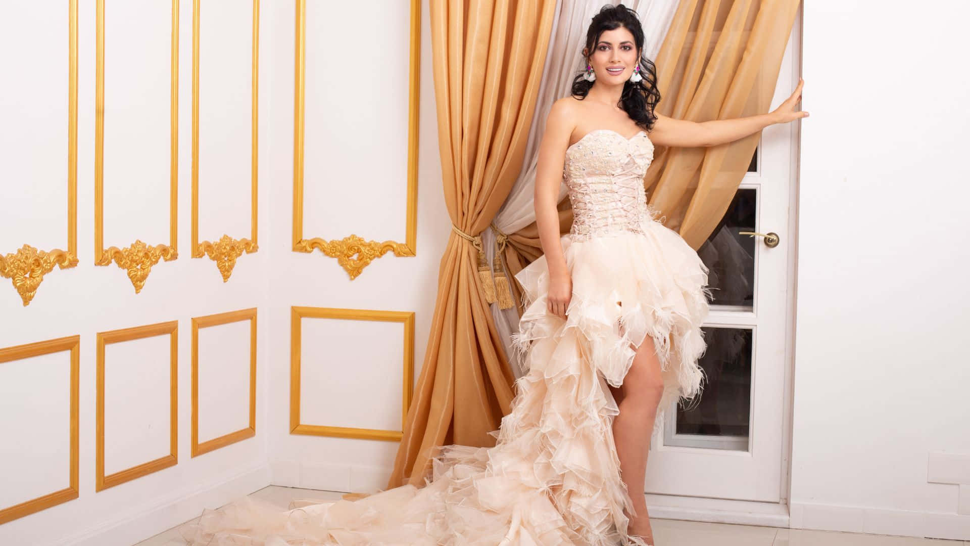 A Woman In A Wedding Dress Posing In Front Of A Door
